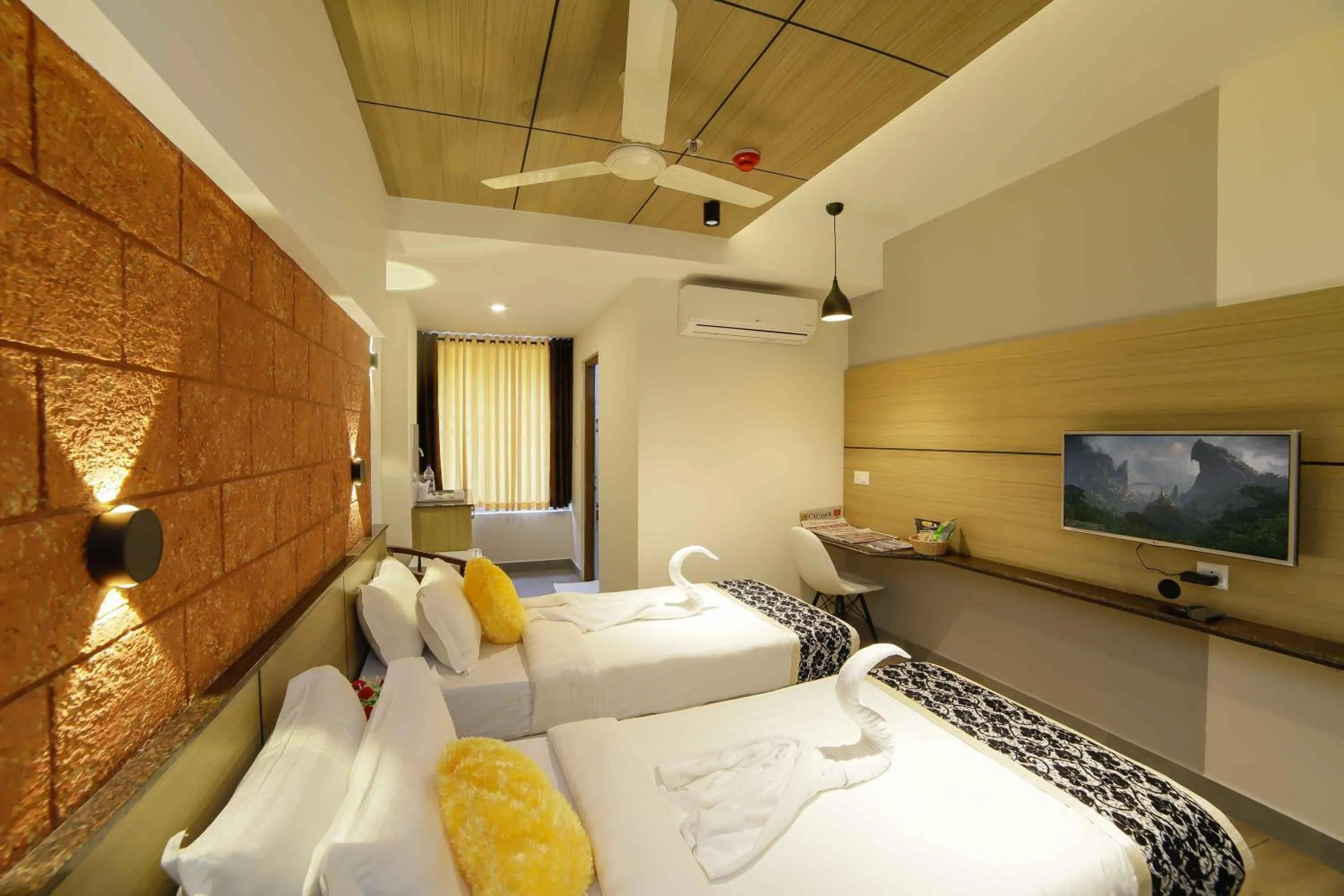 Photo of the whole room, Bed in Bhavanam Regency Guruvayoor