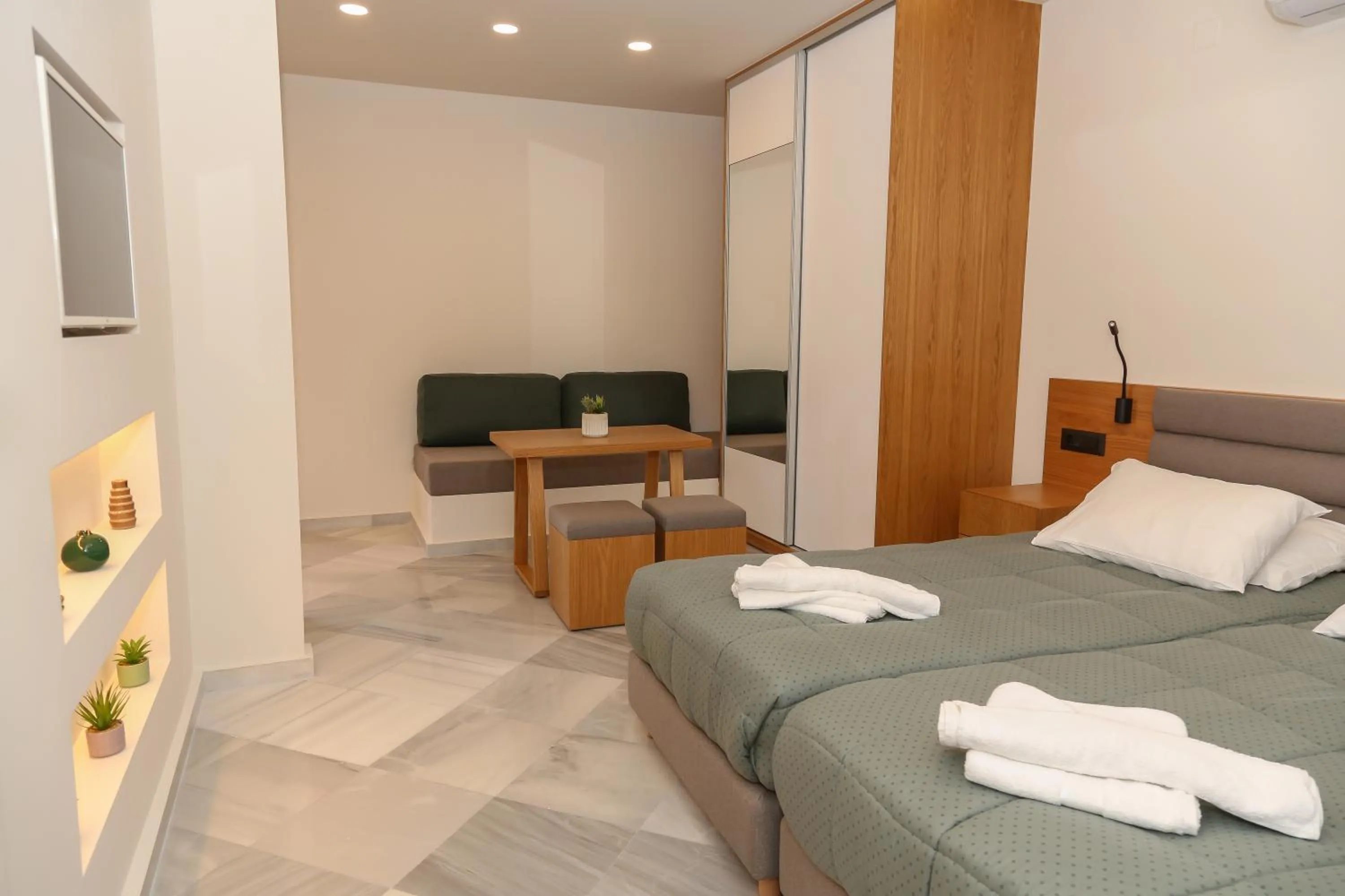 Seating area, Bed in Heaven Apartments