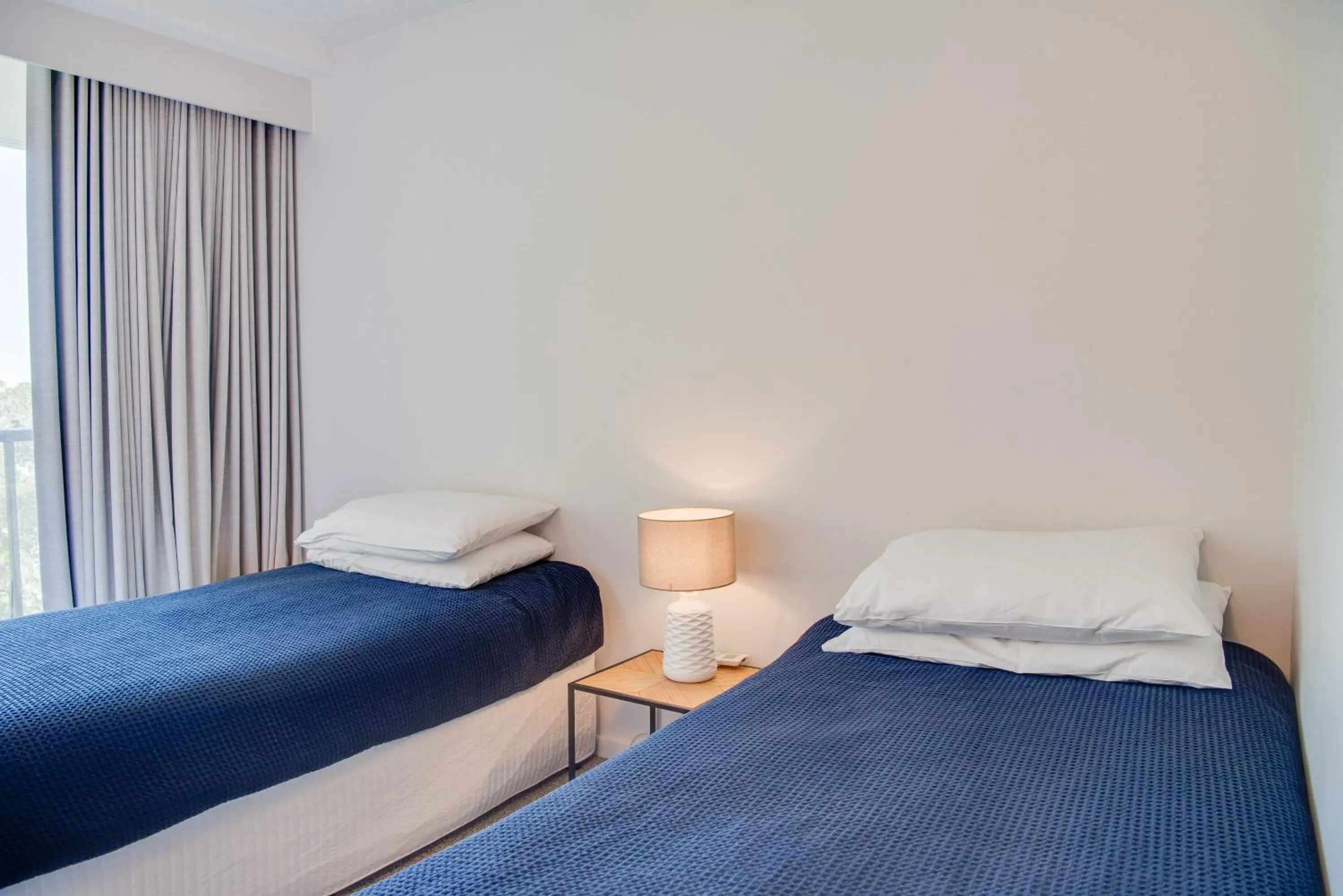 Bedroom, Bed in The Rocks Resort - Official