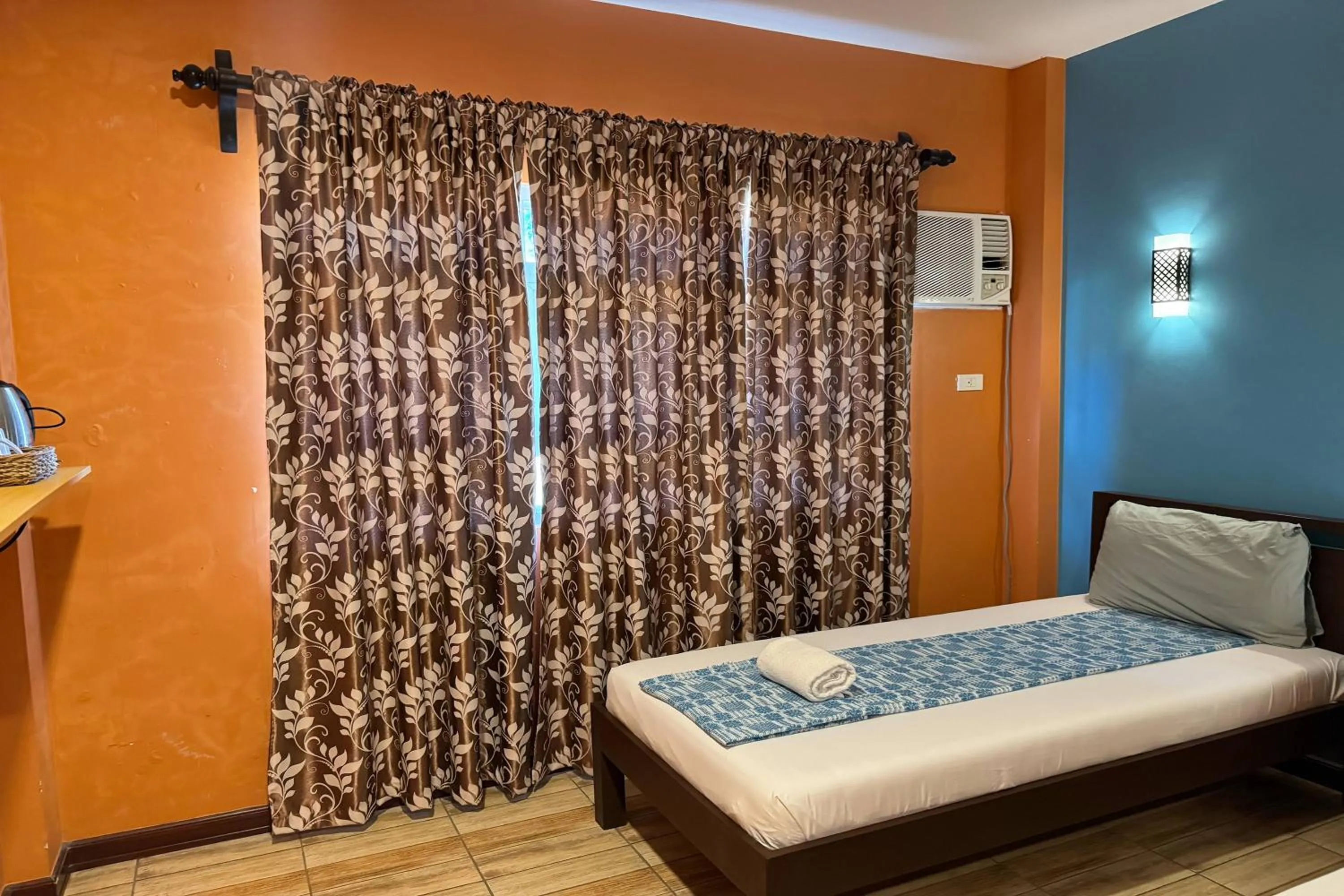 Bed in OveMar Resort Hotel near Vigan