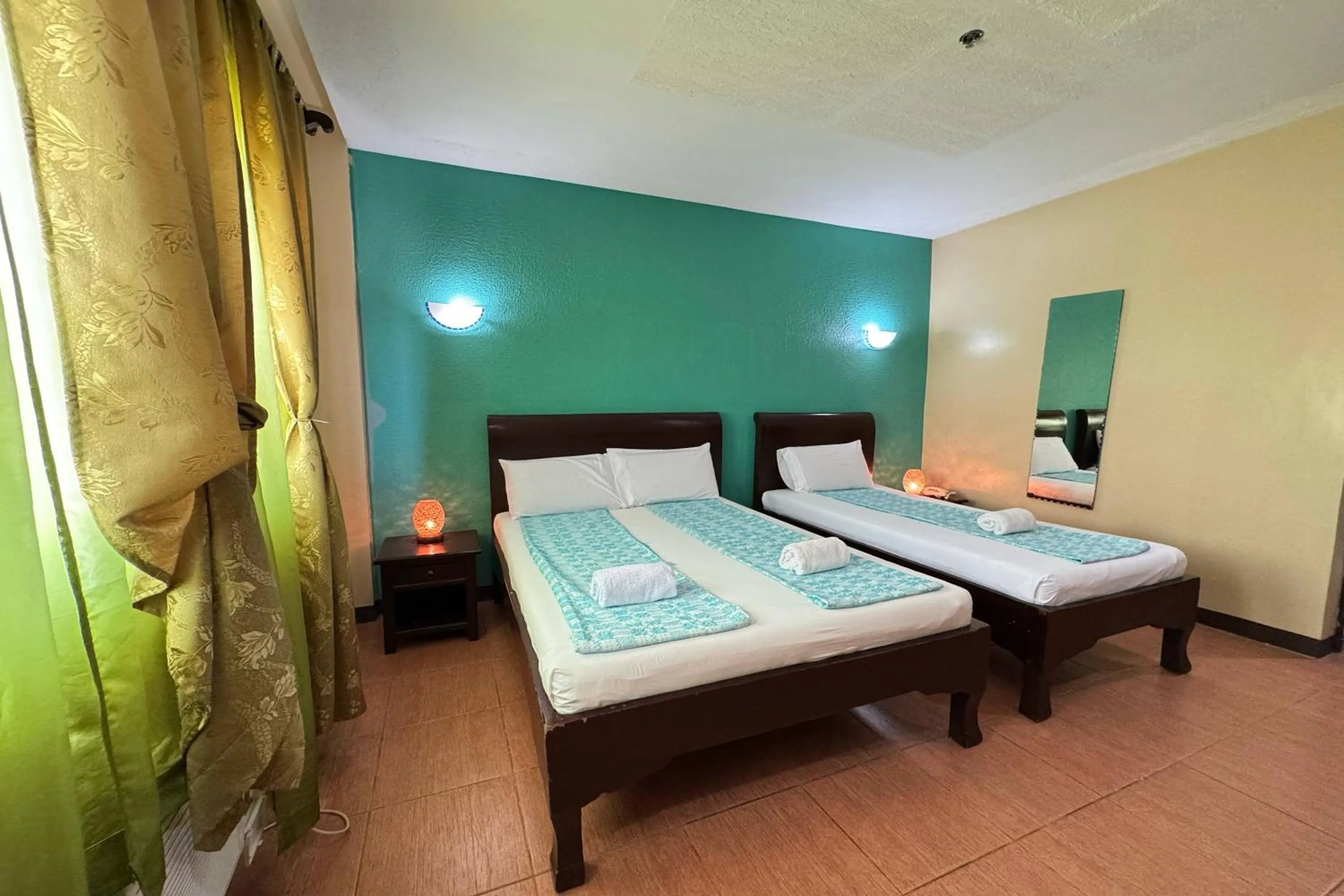 Bed in OveMar Resort Hotel near Vigan