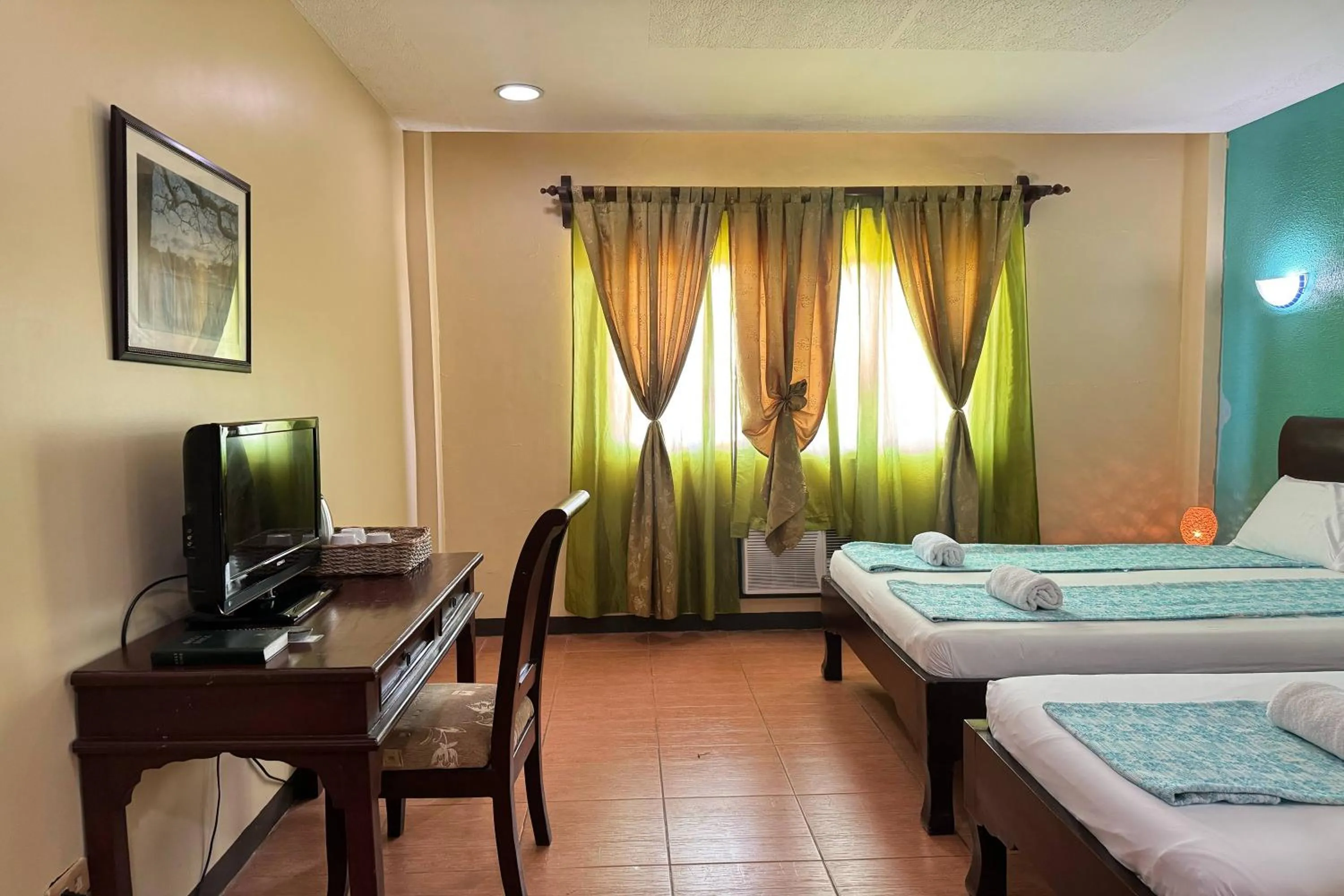 Bed in OveMar Resort Hotel near Vigan