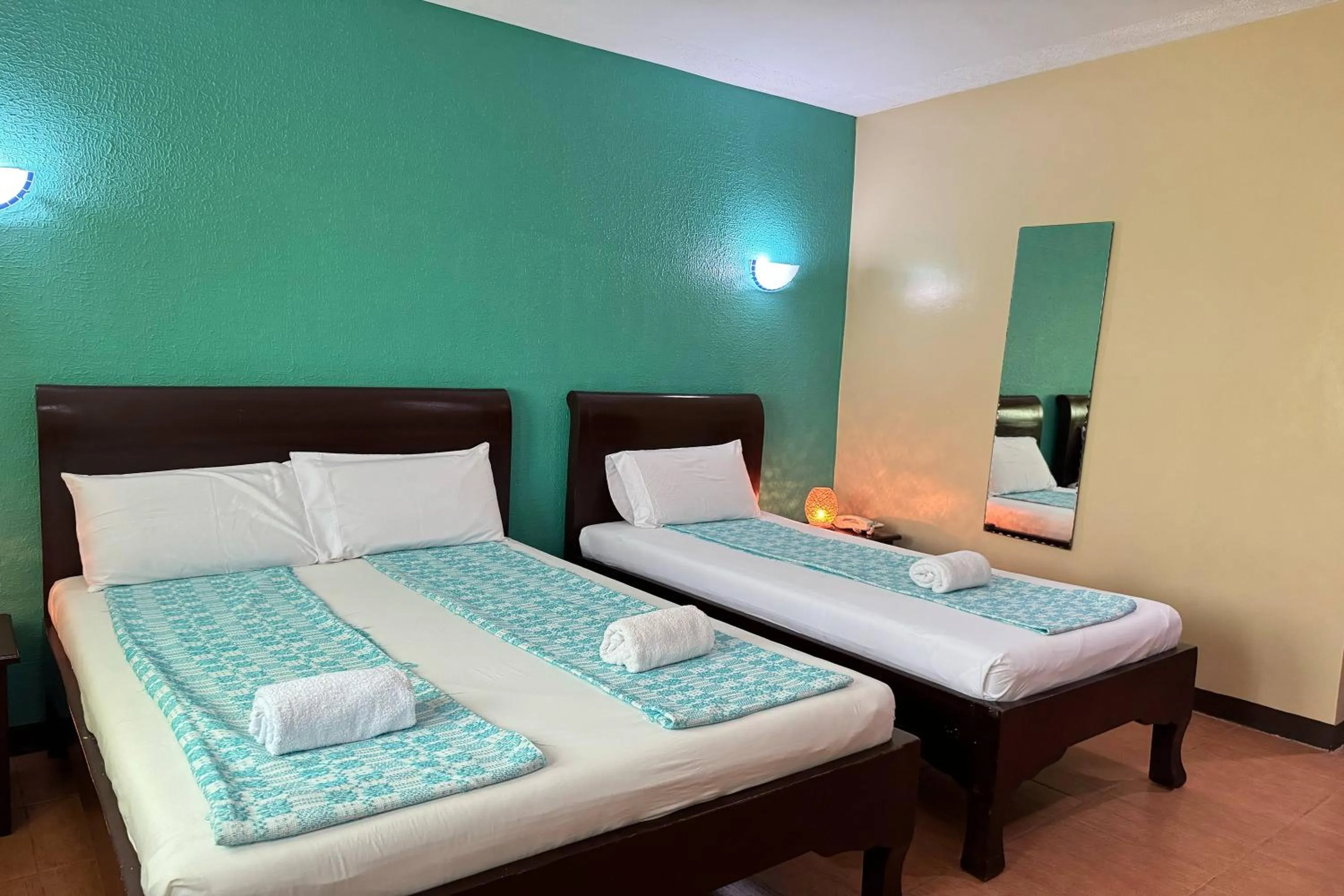 Bed in OveMar Resort Hotel near Vigan