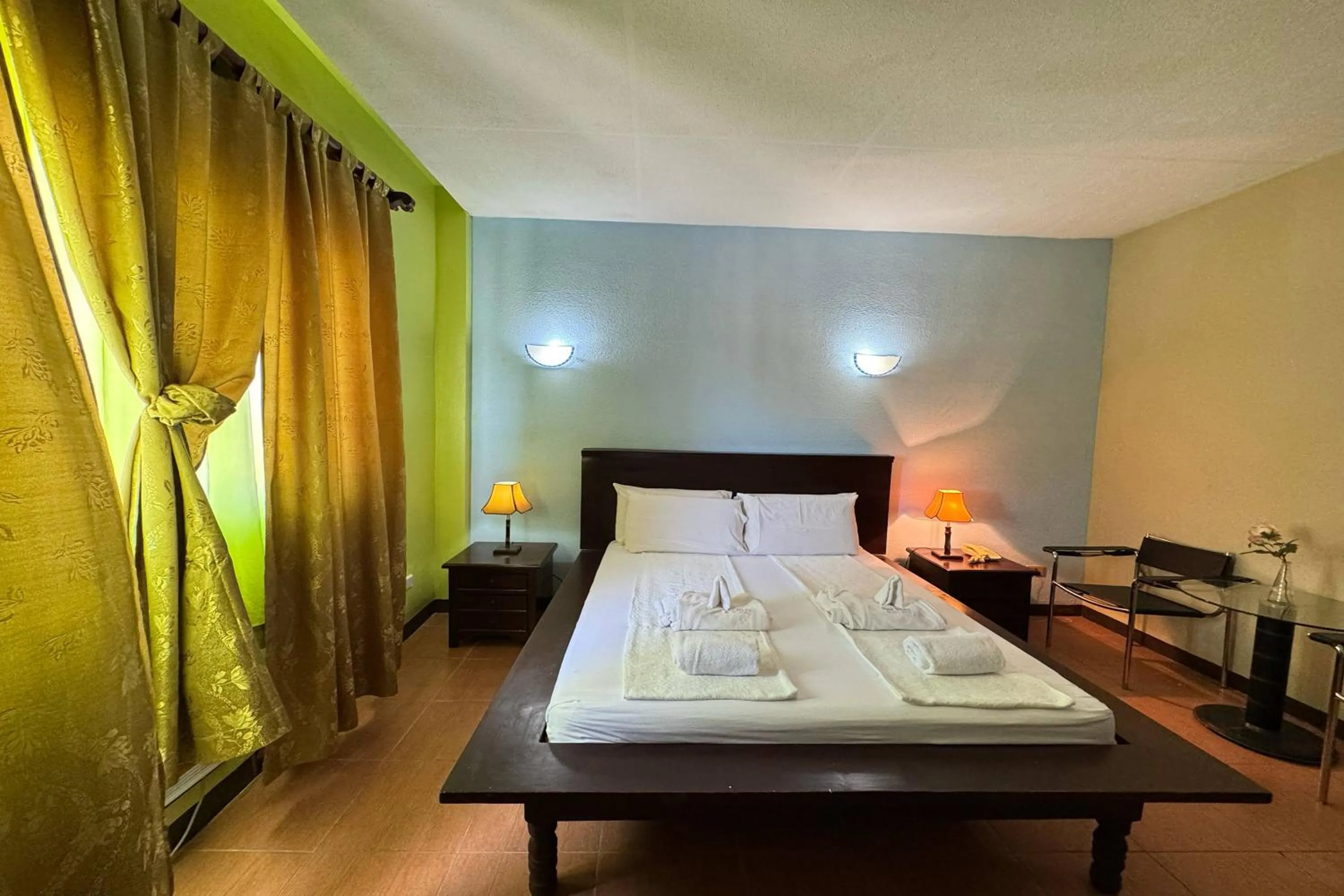 Bed in OveMar Resort Hotel near Vigan