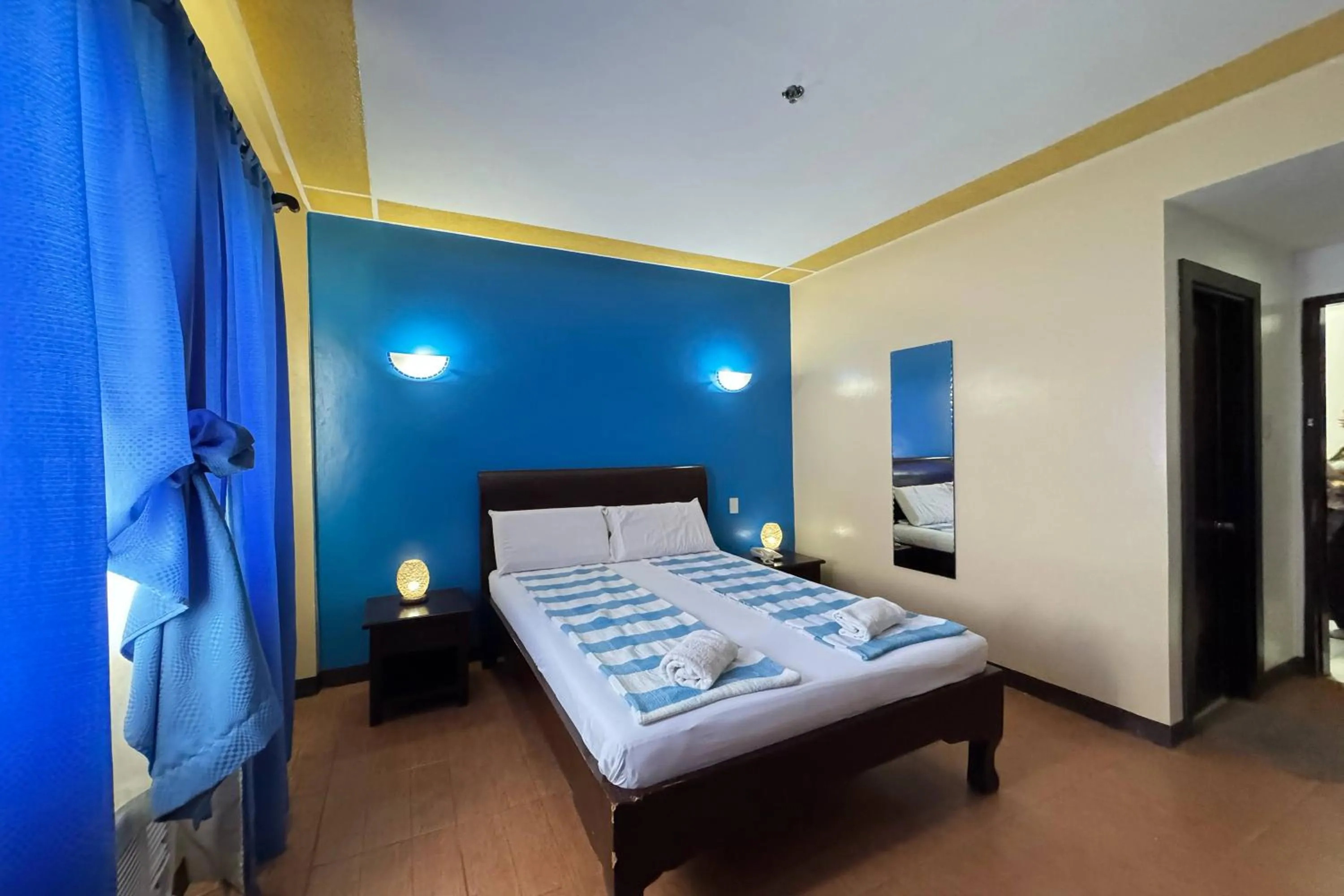 Bed in OveMar Resort Hotel near Vigan