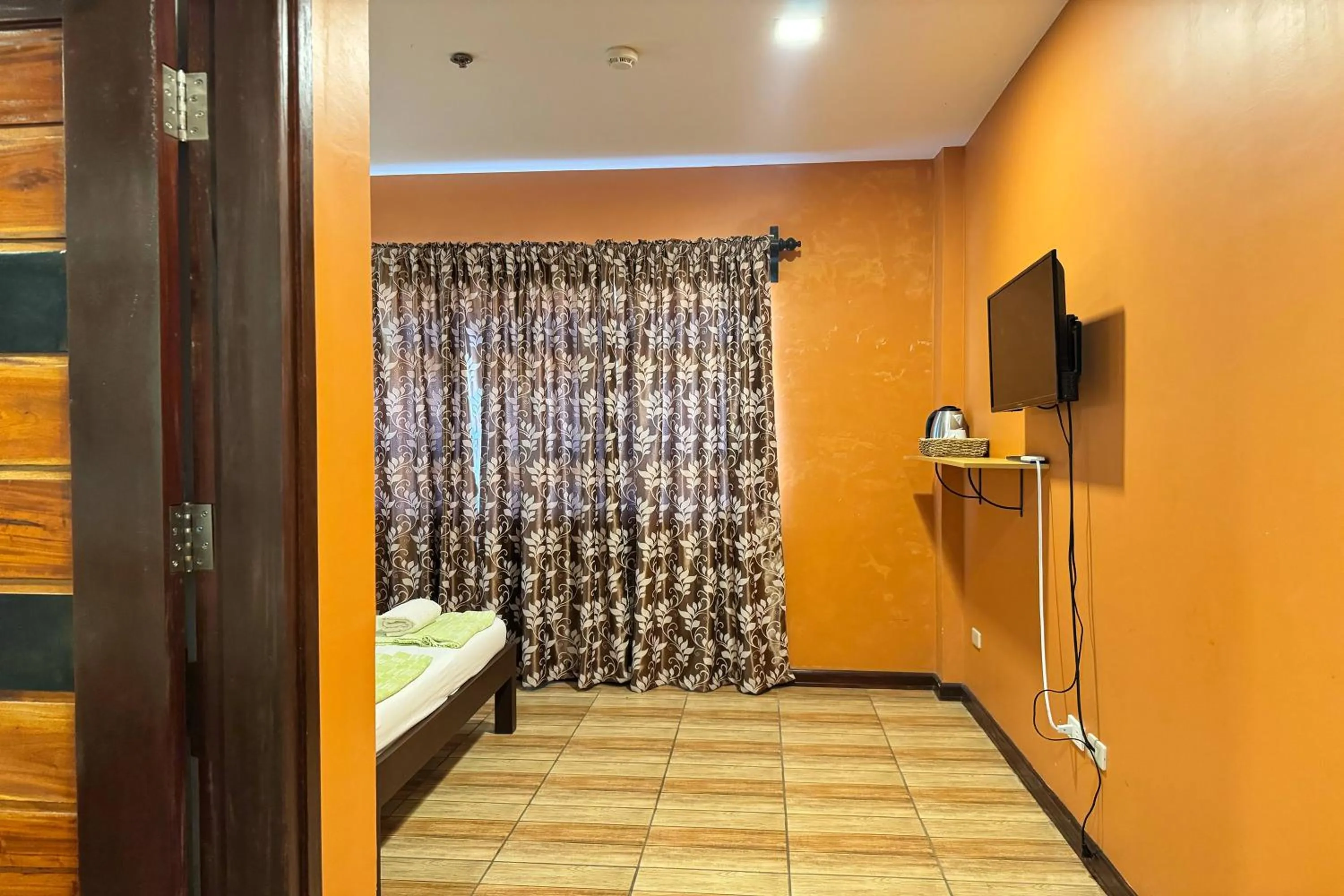 Bed in OveMar Resort Hotel near Vigan