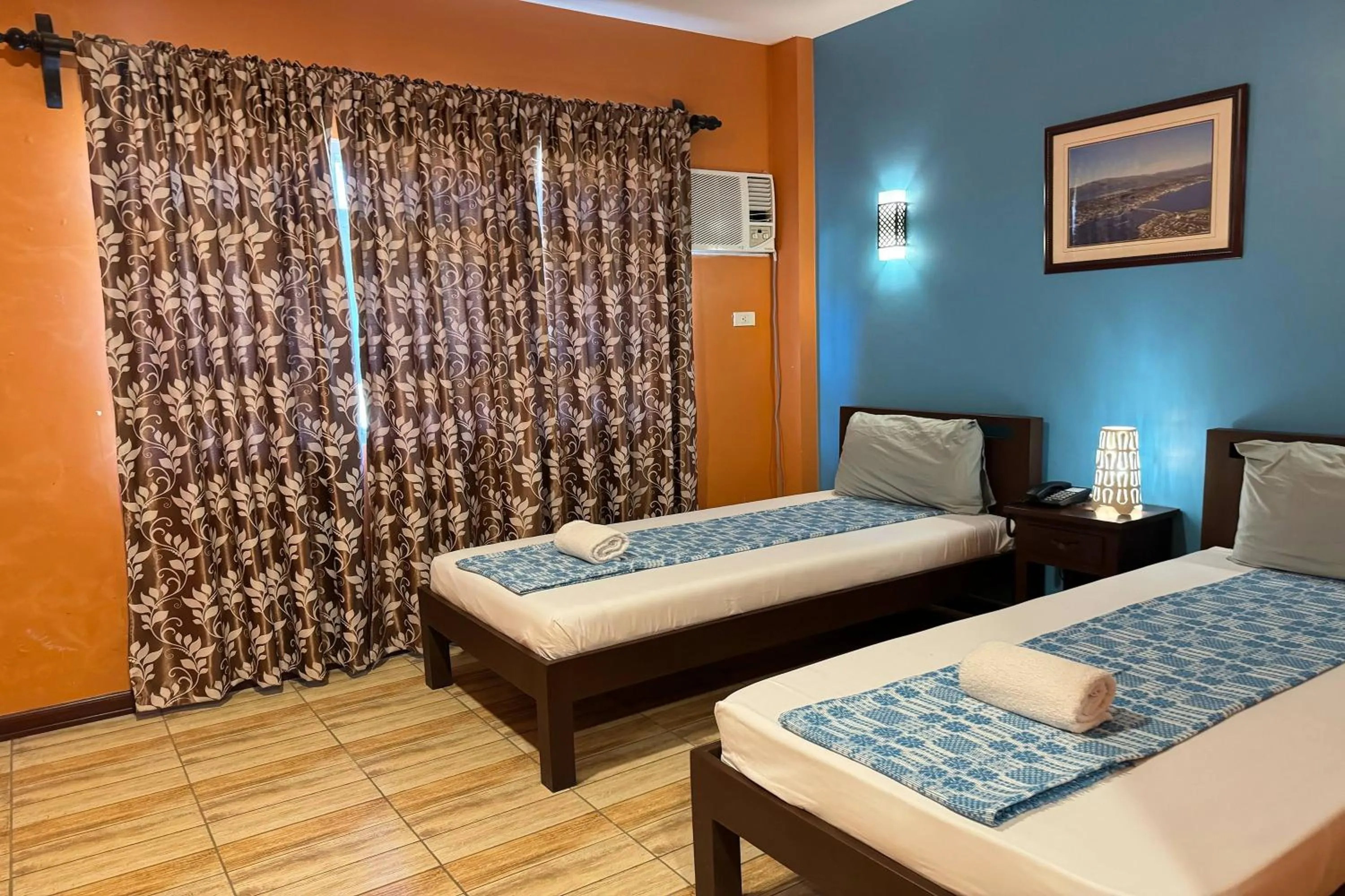 Bed in OveMar Resort Hotel near Vigan