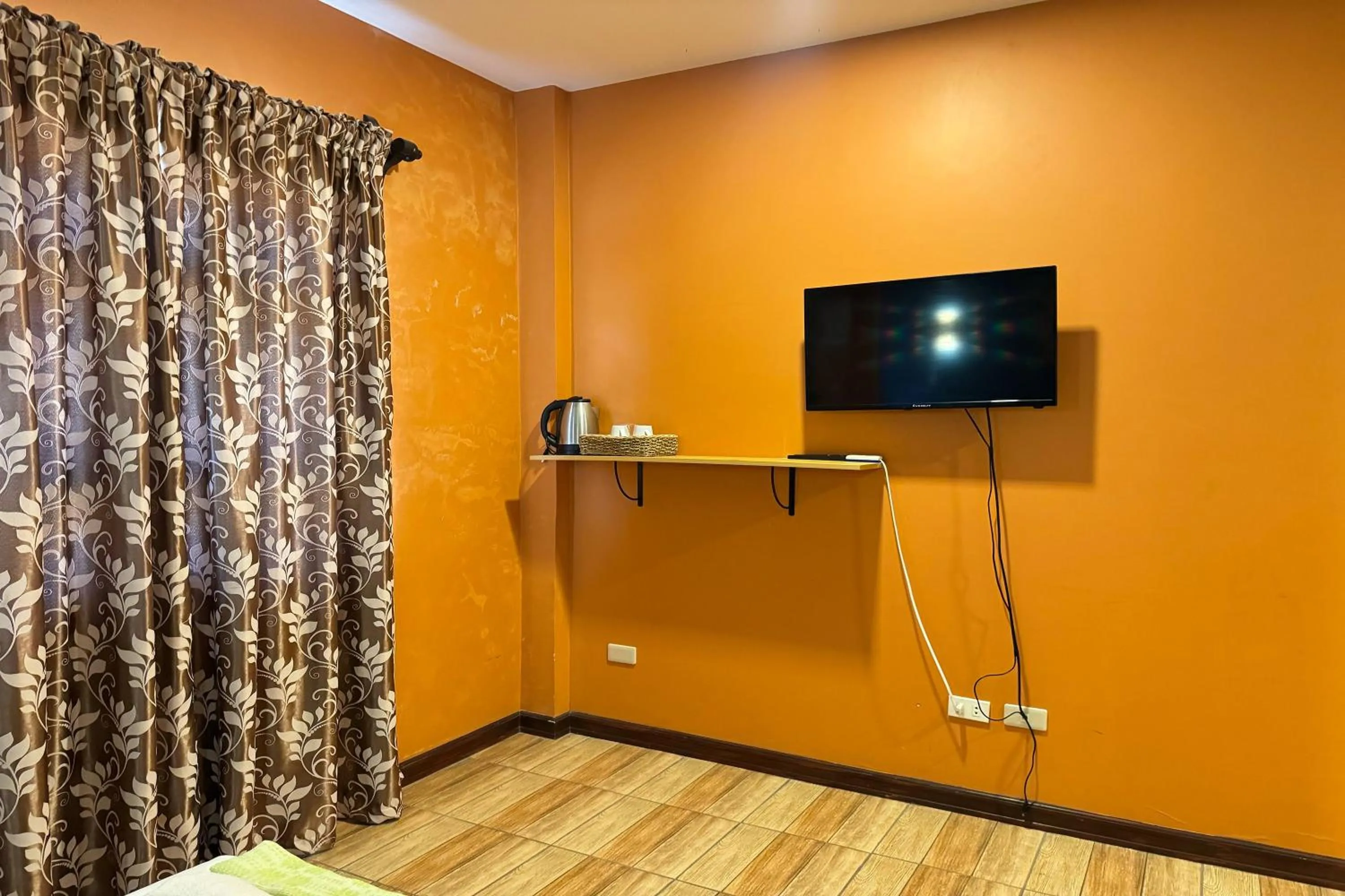 Bed in OveMar Resort Hotel near Vigan