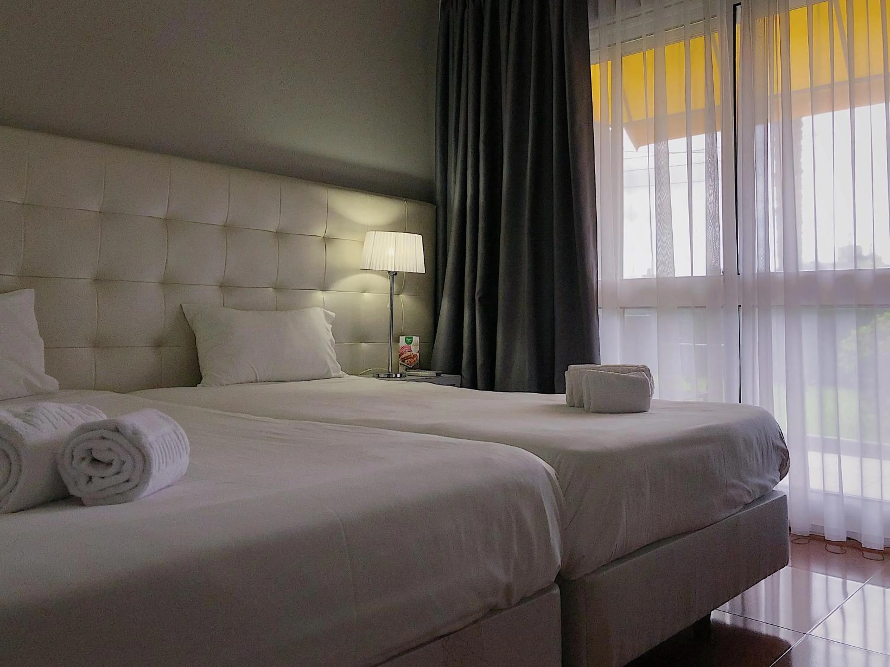 Bed in Vila Hotel By VimaHotels