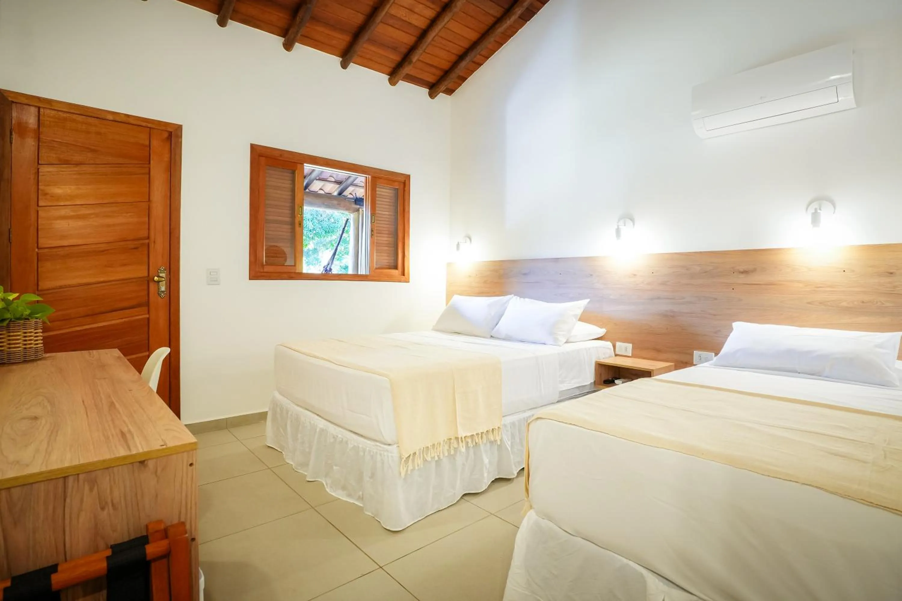 Bed in VELINN Pousada Bromelias