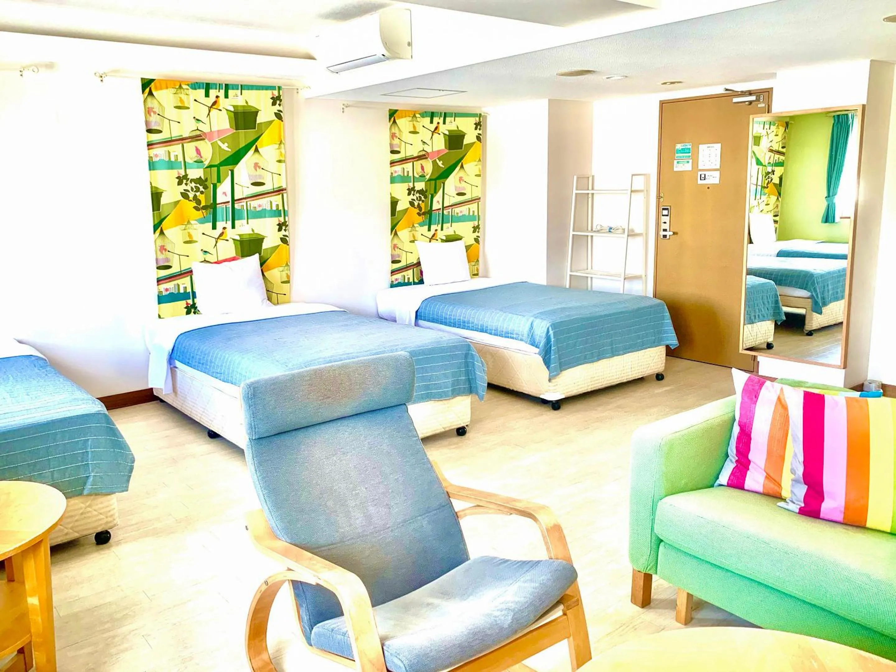 Living room, Bed in Hotel Happy Holiday Ishigaki