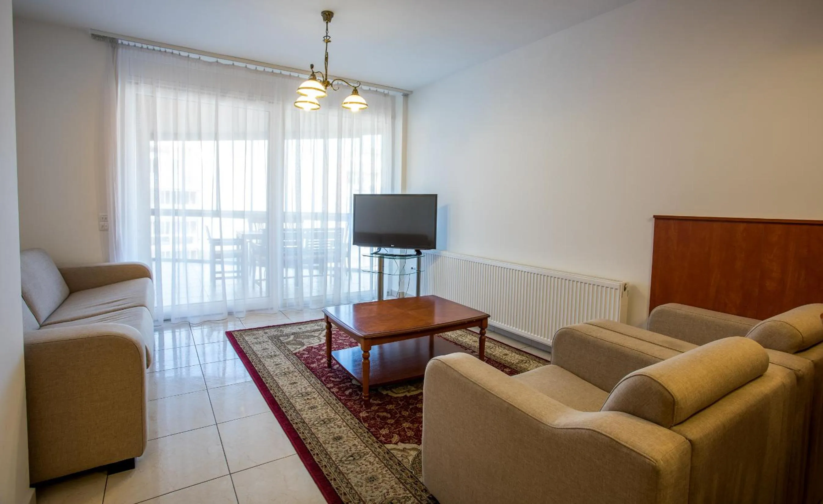 TV and multimedia in Luxury Apartment Hotel Siófok