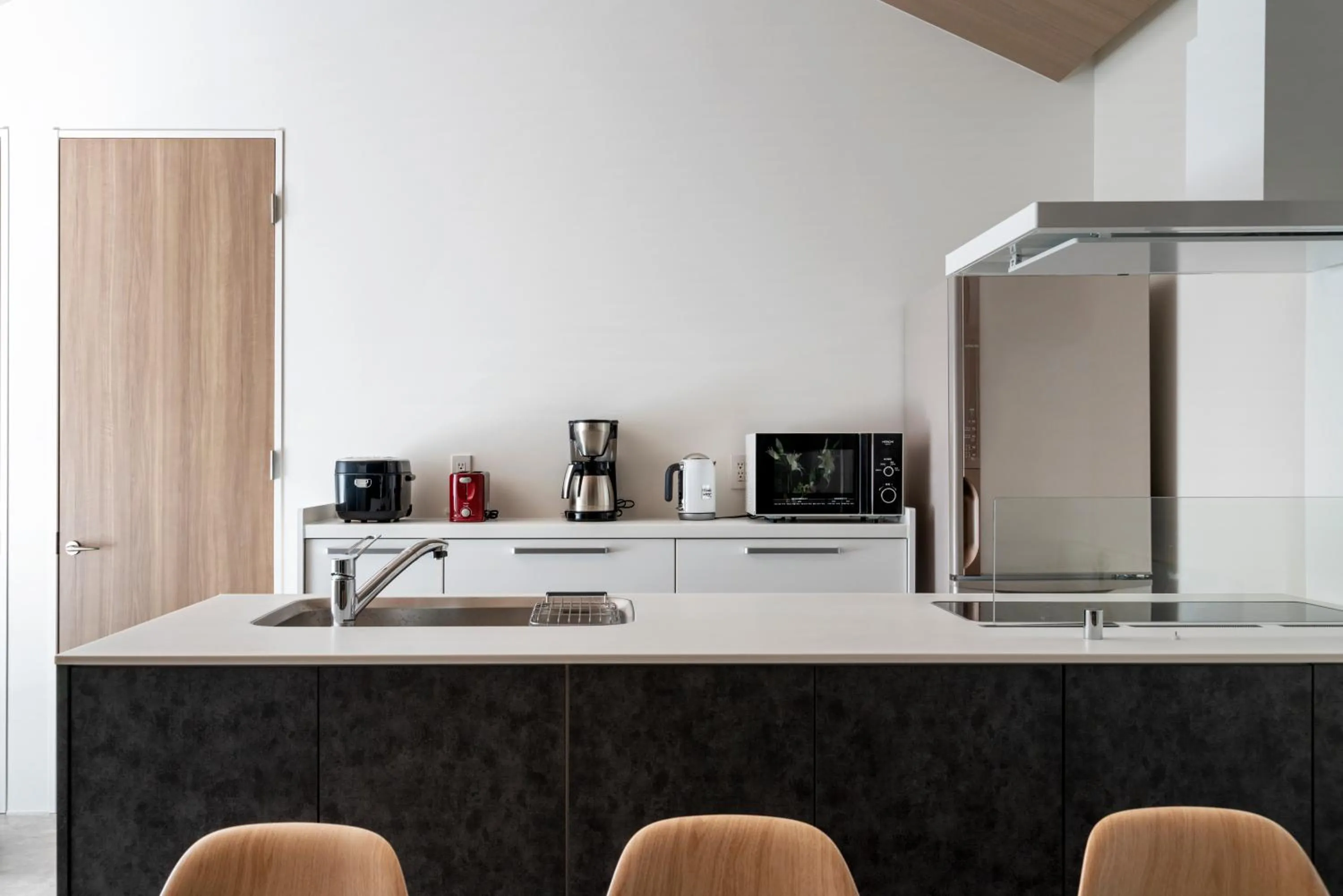 kitchen in Grey Wolf Chalet by Hakuba White Fox Company