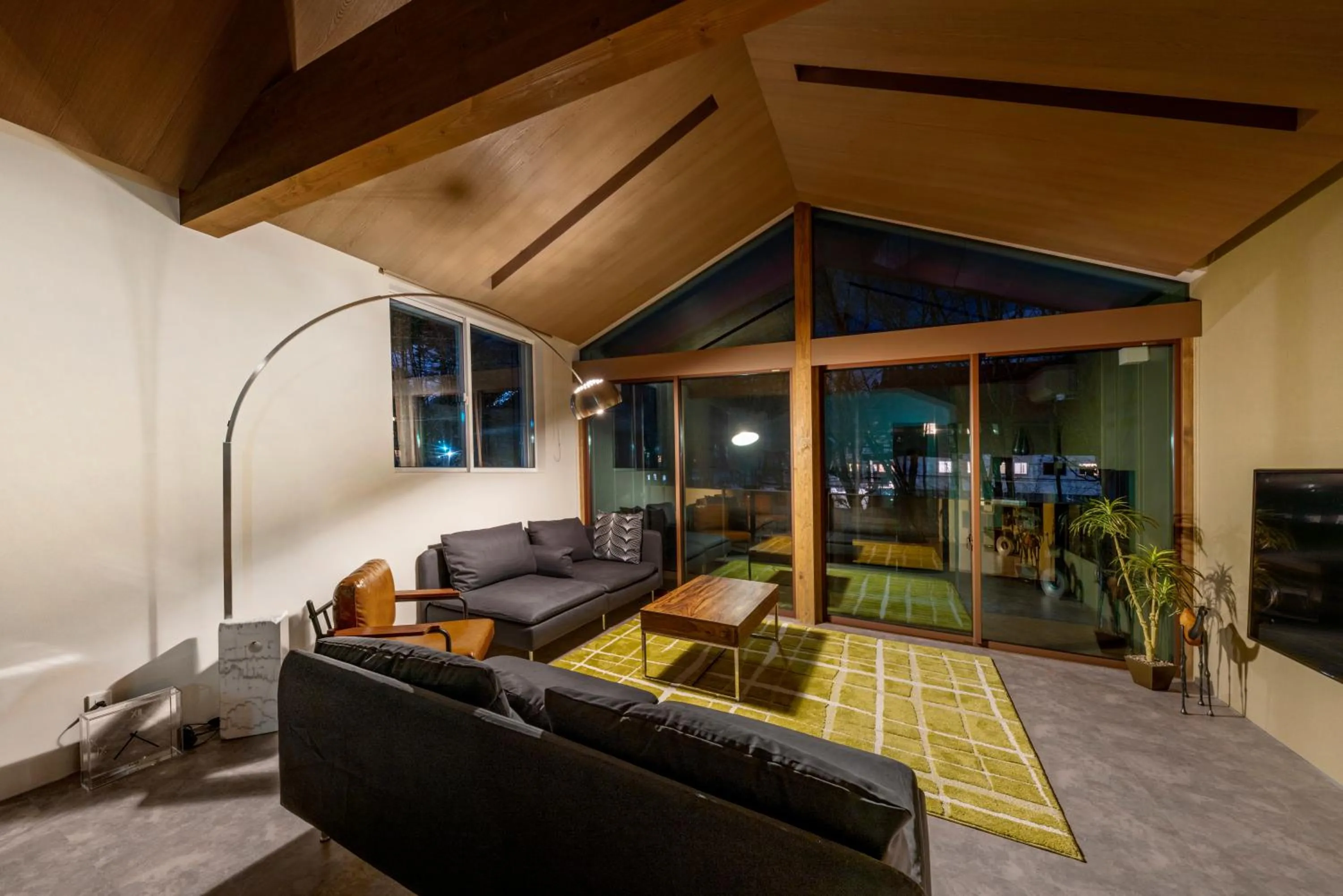 Living room in Grey Wolf Chalet by Hakuba White Fox Company