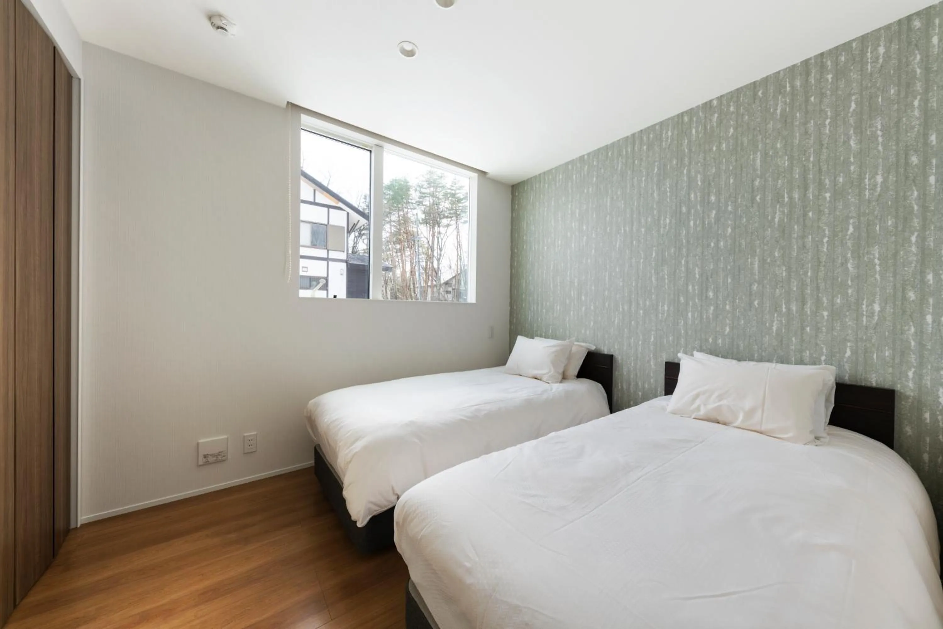 Bed in Grey Wolf Chalet by Hakuba White Fox Company