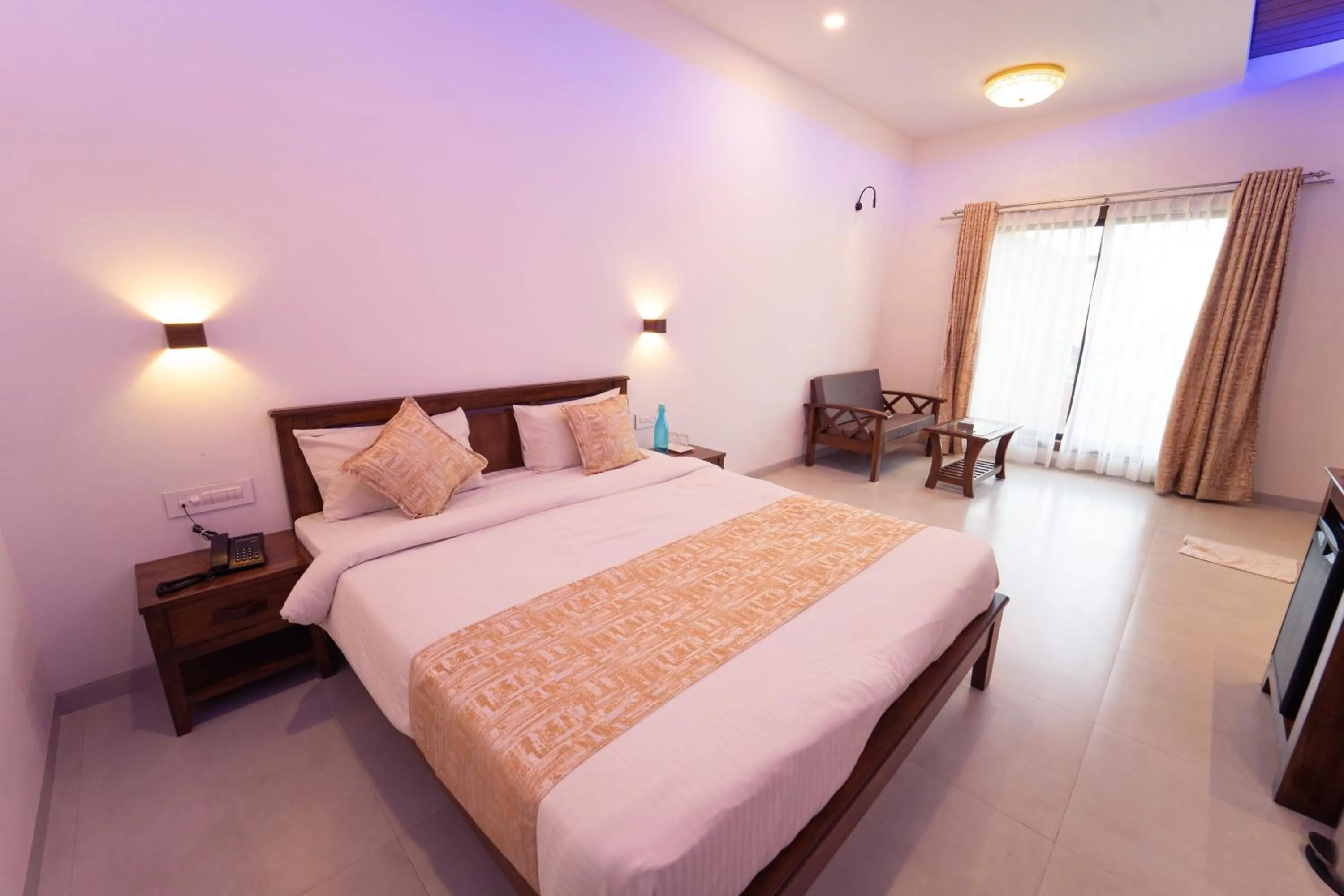 Bed in La Serene Resort and Spa