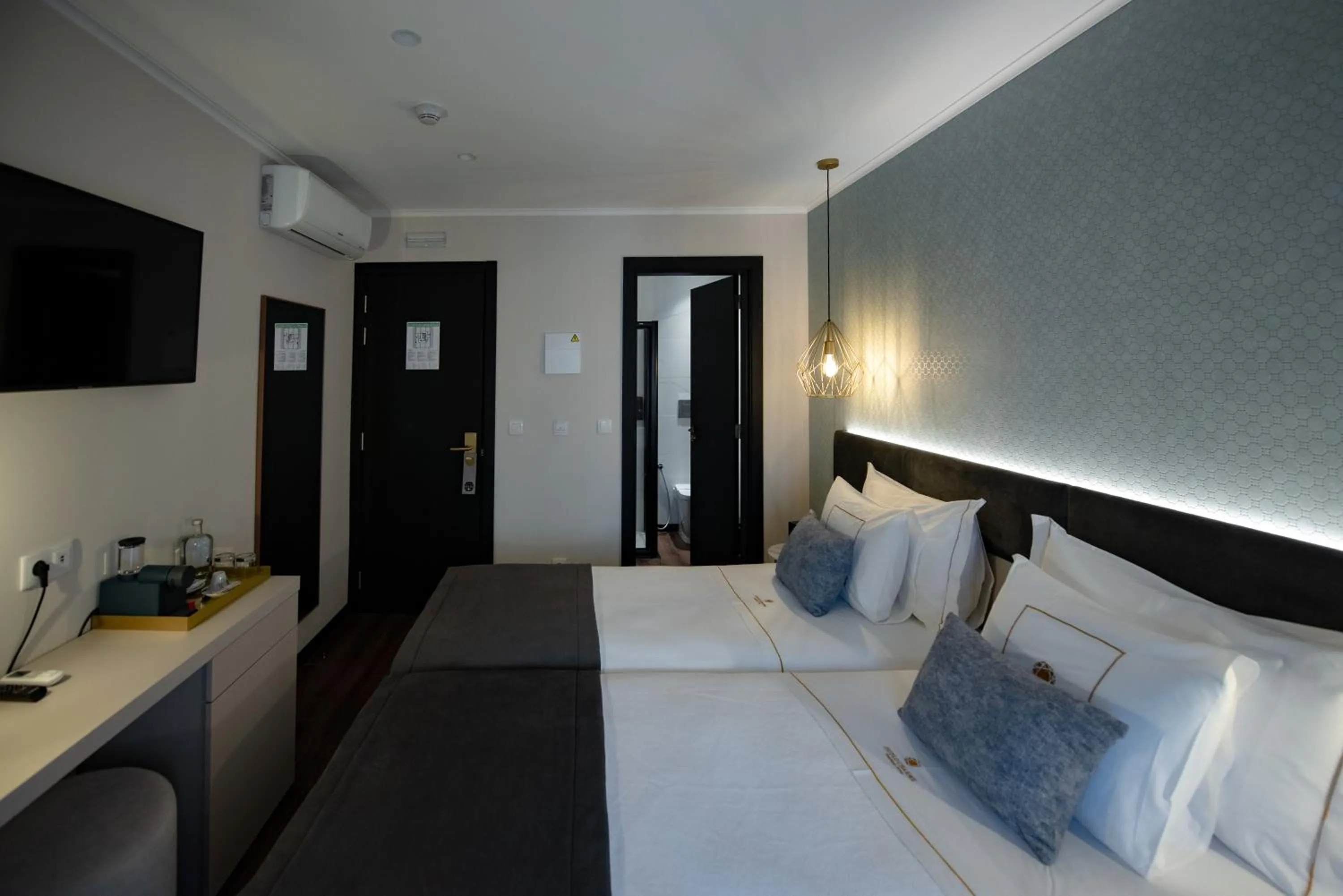 Bed in Duplo Charme Boutique Hotel