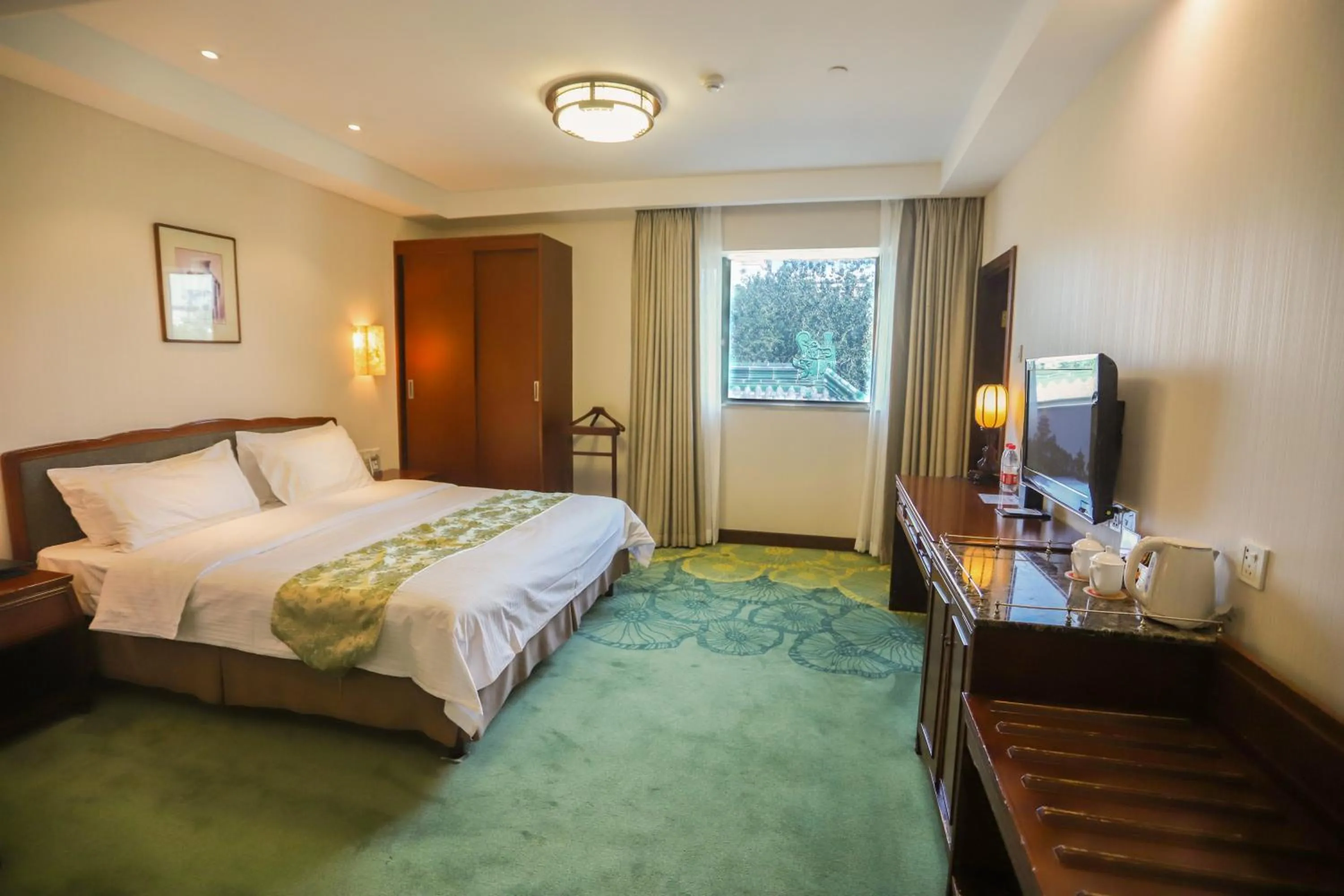 Photo of the whole room, Bed in Jade Garden Hotel