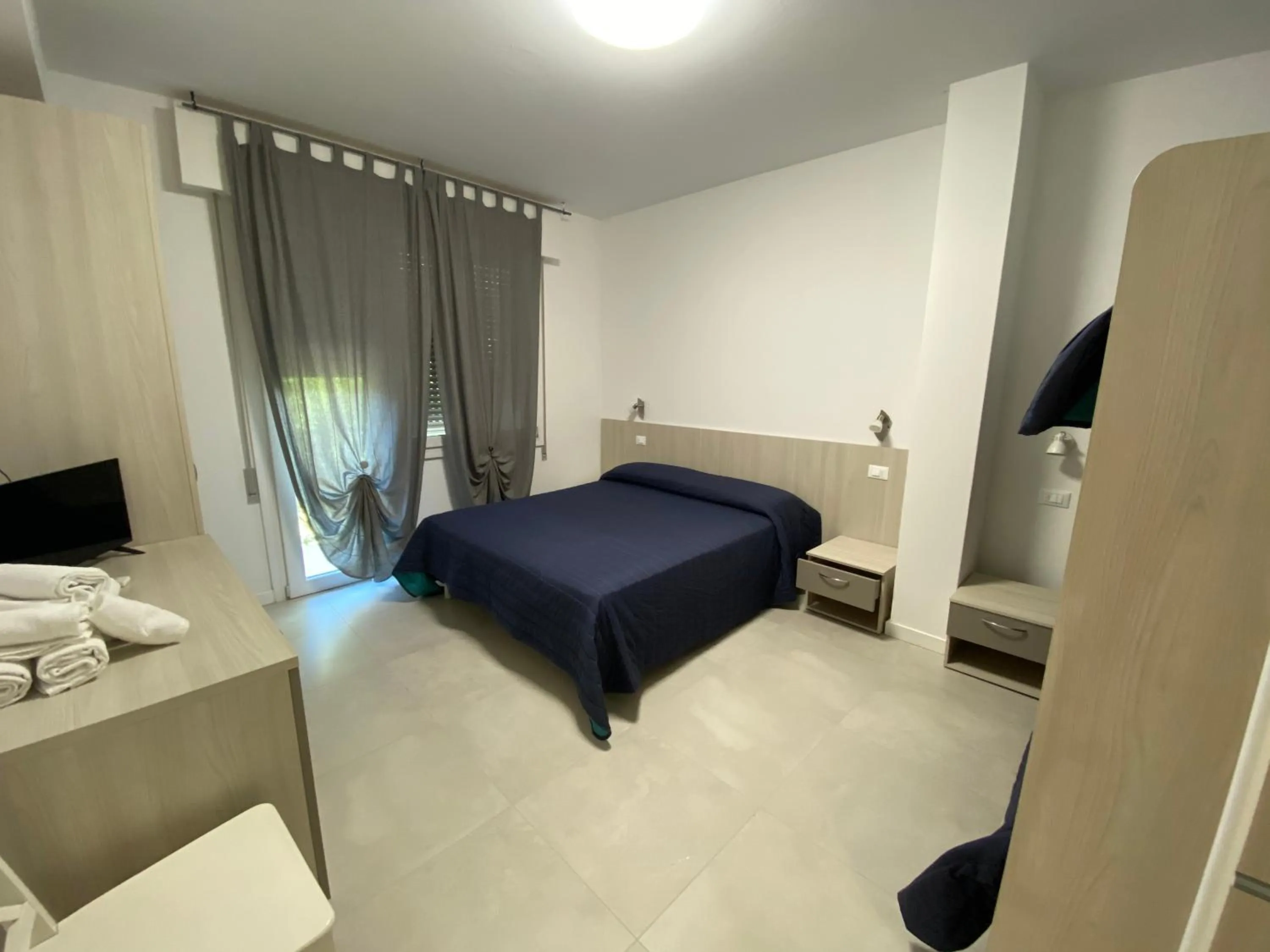 Bed in Lilium Maris Hotel