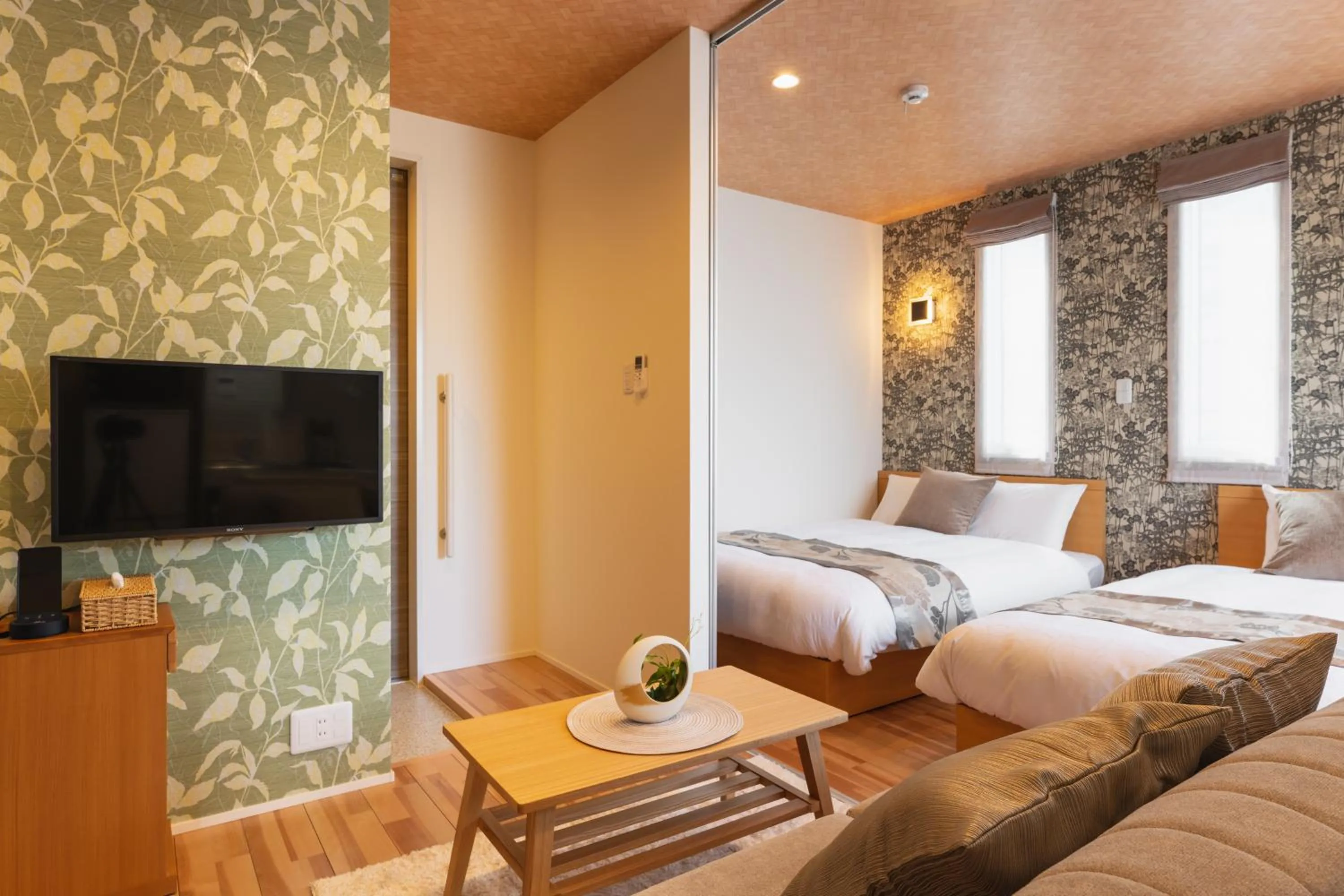 Communal lounge/ TV room, Bed in Ambicia Sasebo