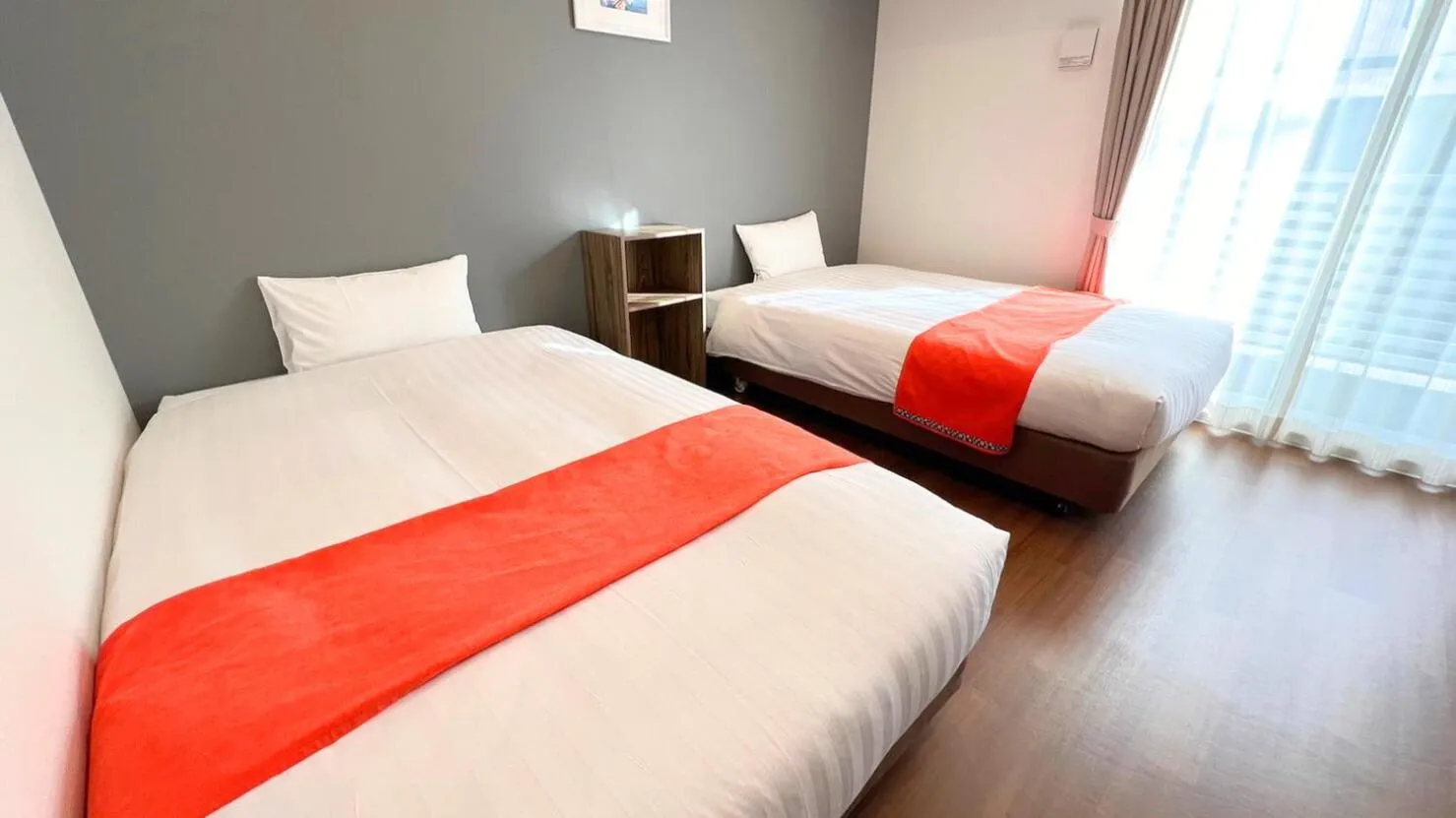 Bed in Apartment Hotel Ecott