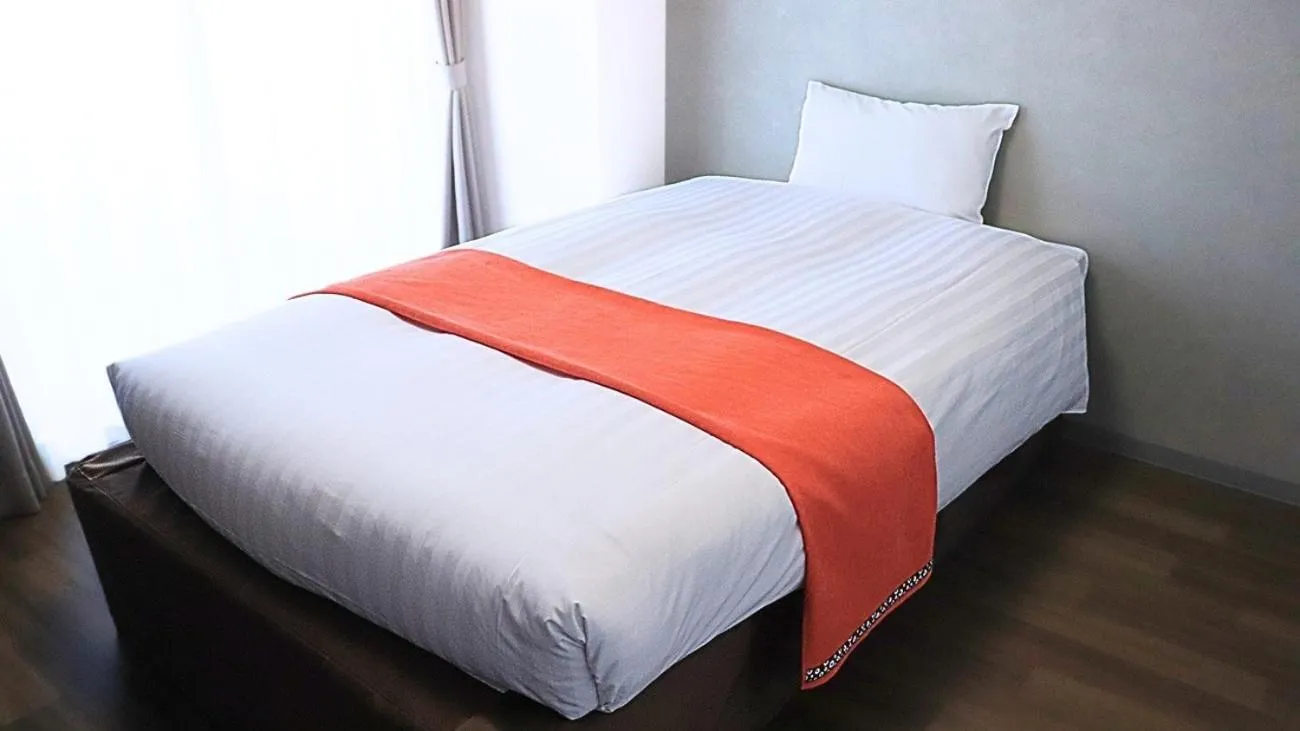 Bed in Apartment Hotel Ecott