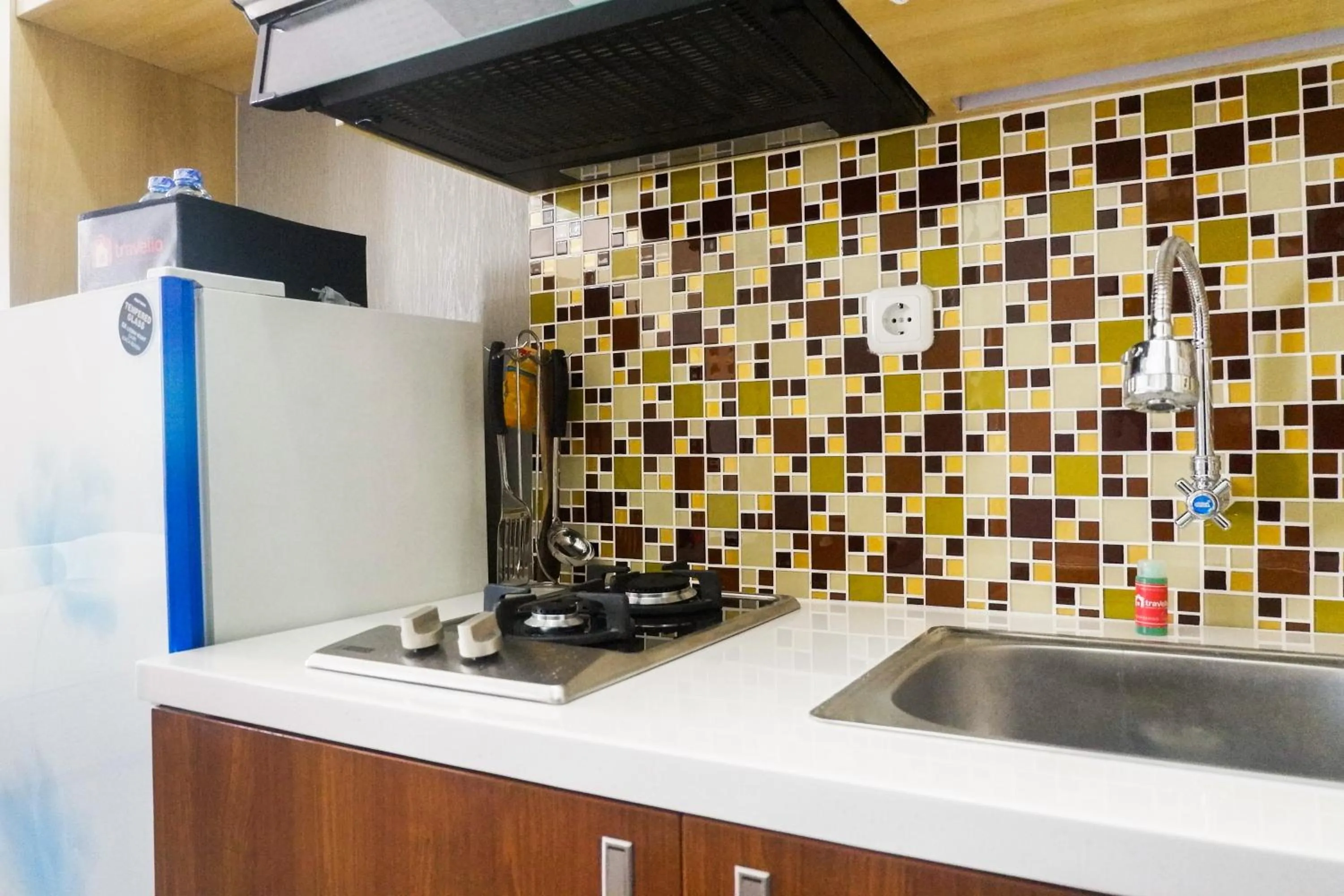 Kitchen or kitchenette in Comfy Studio Apartment at Menara Rungkut By Travelio