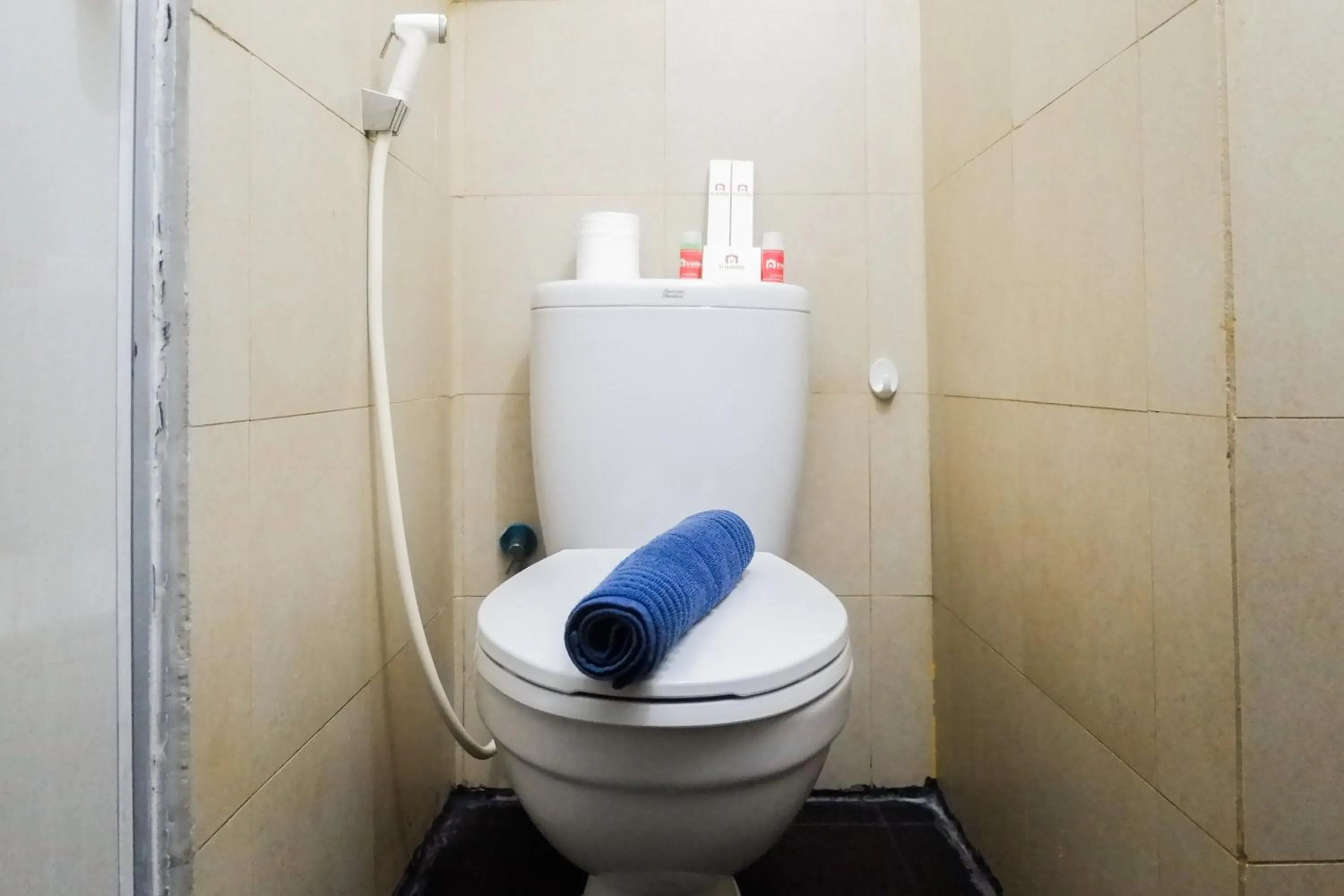 Bathroom in Comfy Studio Apartment at Menara Rungkut By Travelio