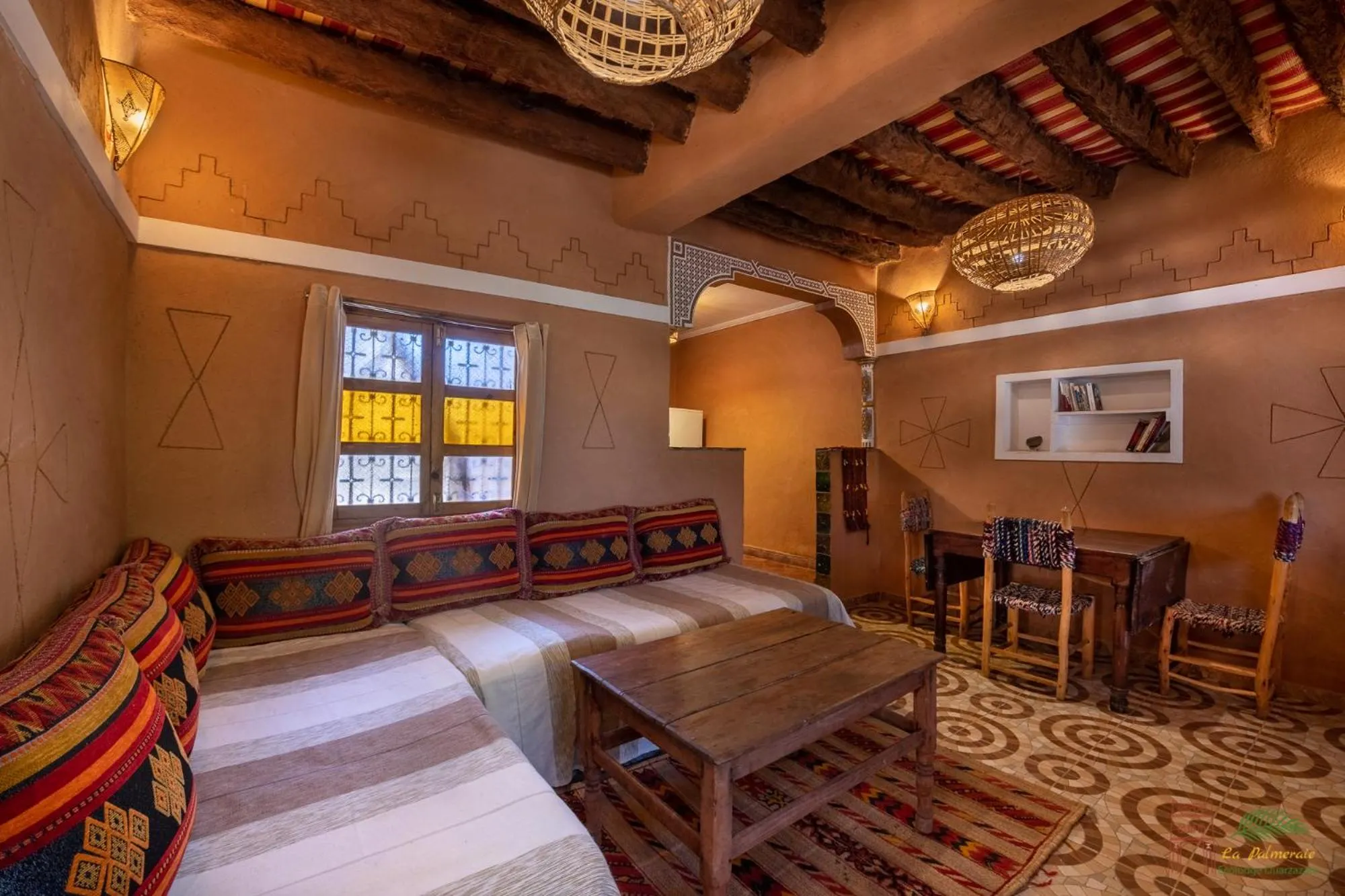 Living room, Bed in Ecolodge La Palmeraie