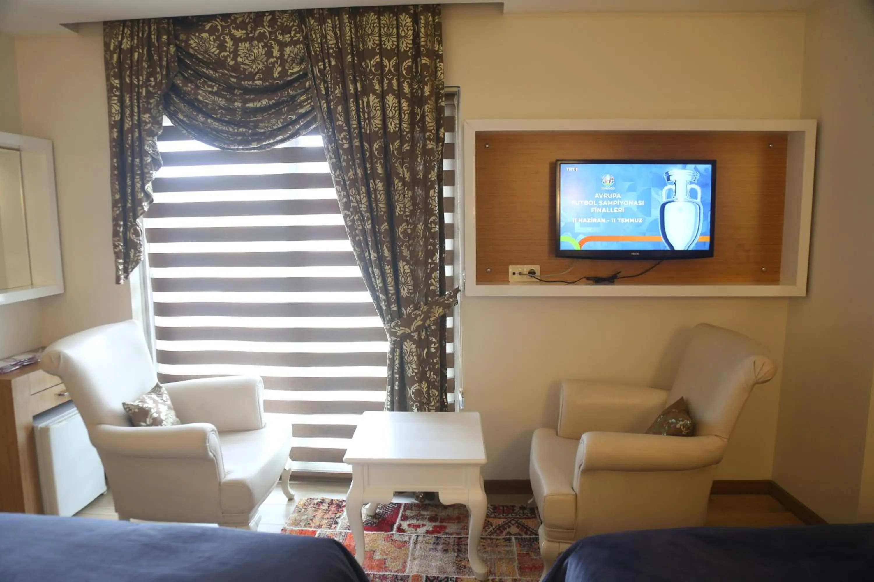 Communal lounge/ TV room in Cebeciler Hotel