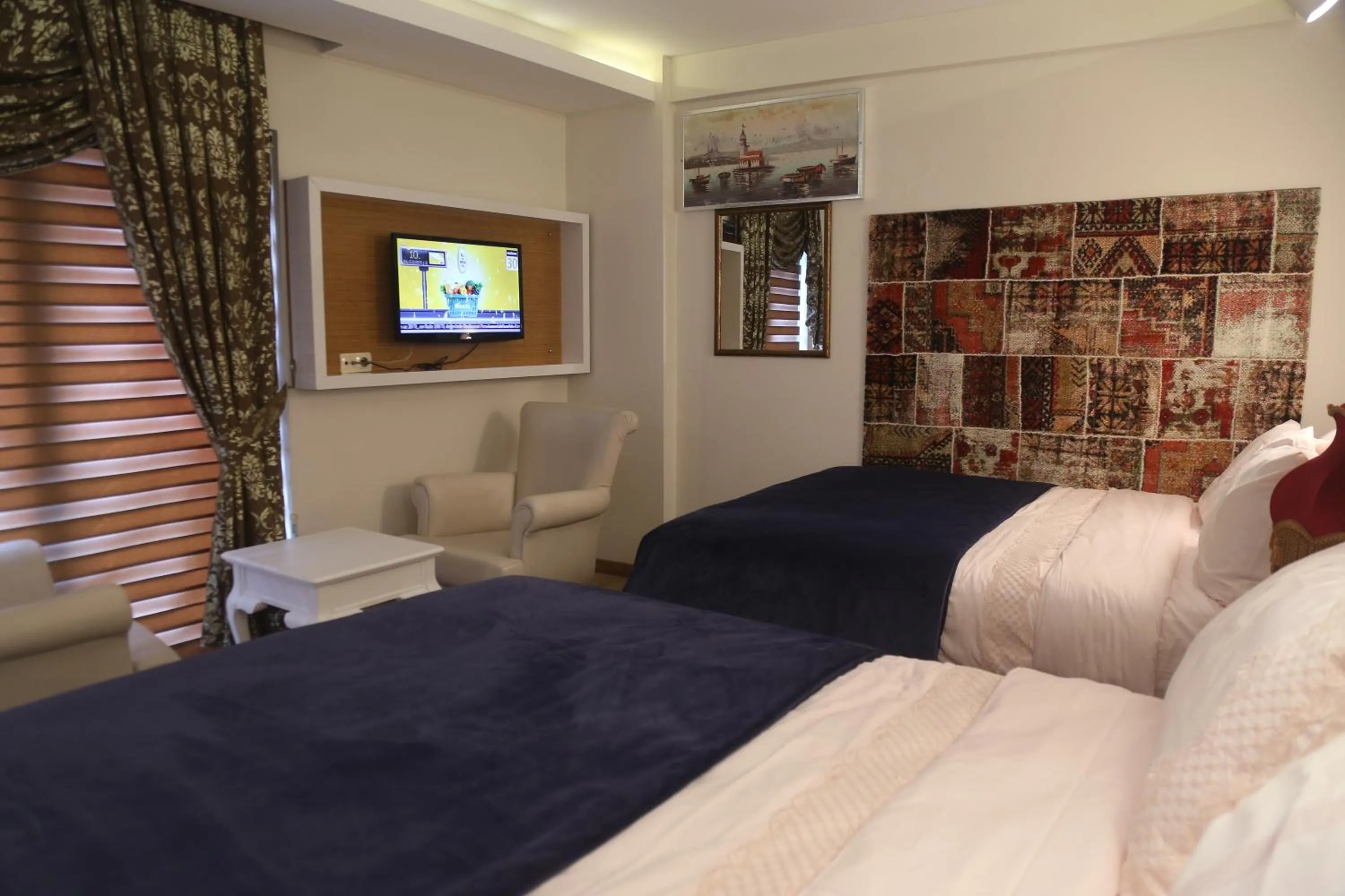 Communal lounge/ TV room, Bed in Cebeciler Hotel