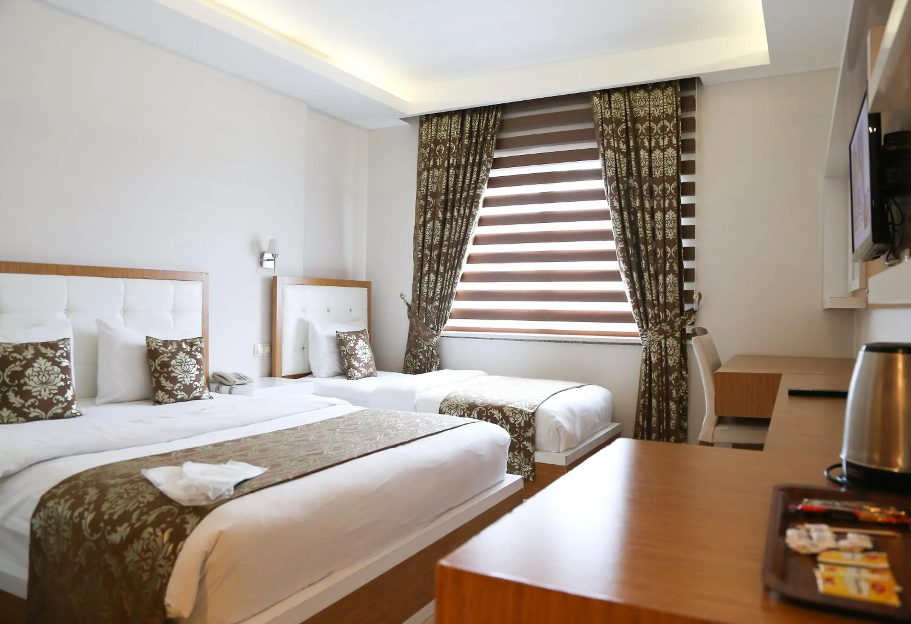 Bed in Cebeciler Hotel