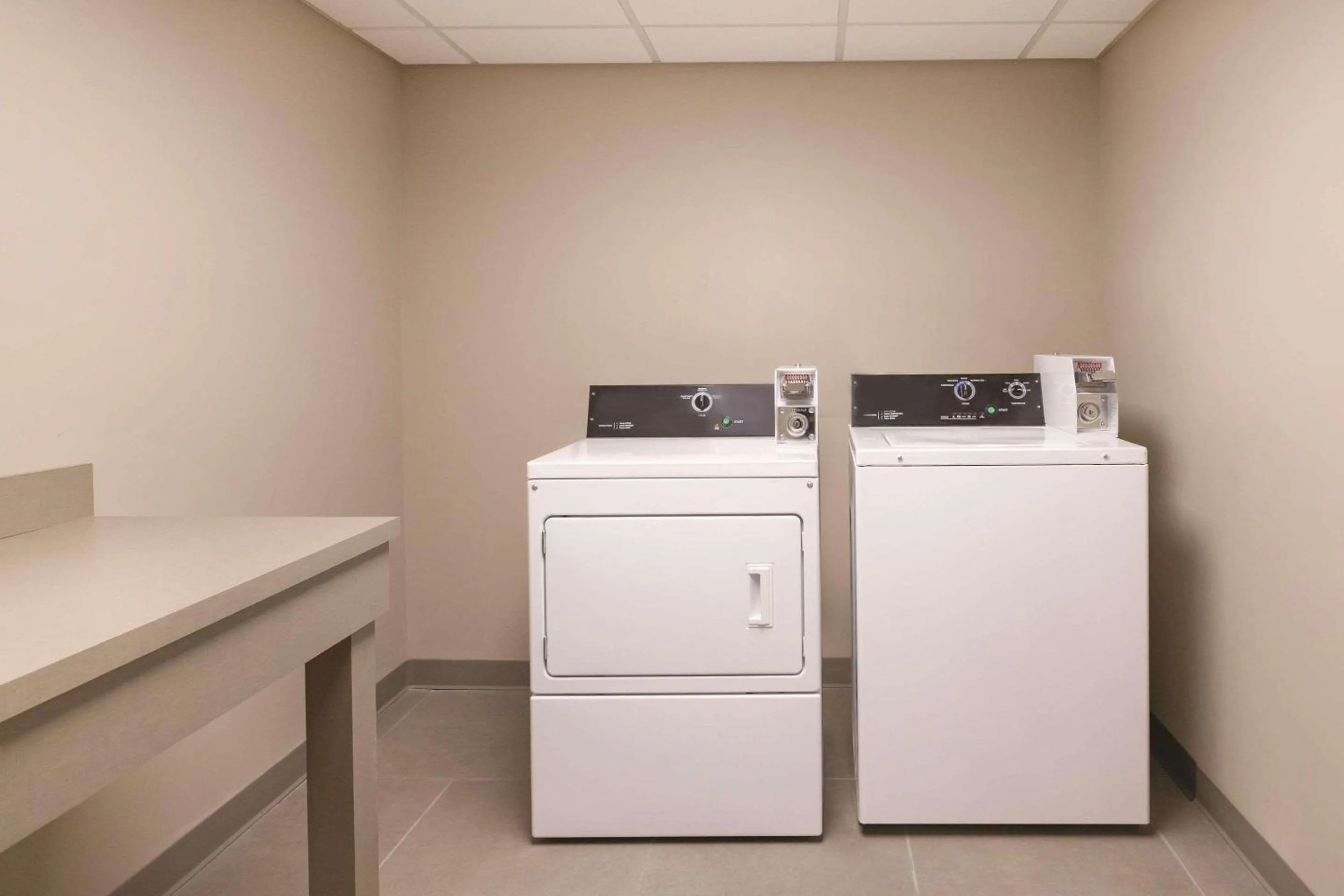 laundry in Country Inn & Suites by Radisson, Macon West, GA