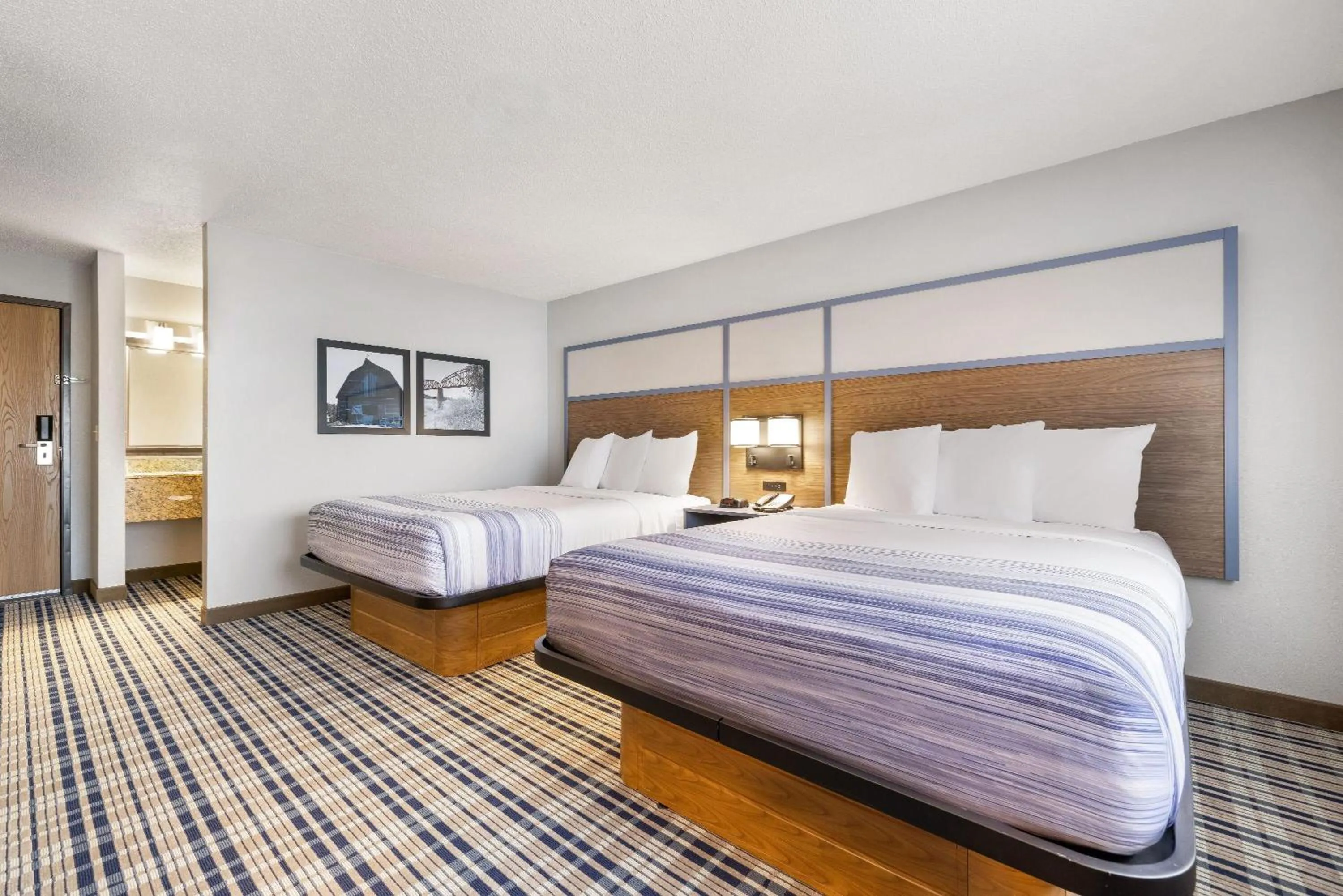 Bed in AmericInn by Wyndham Bismarck