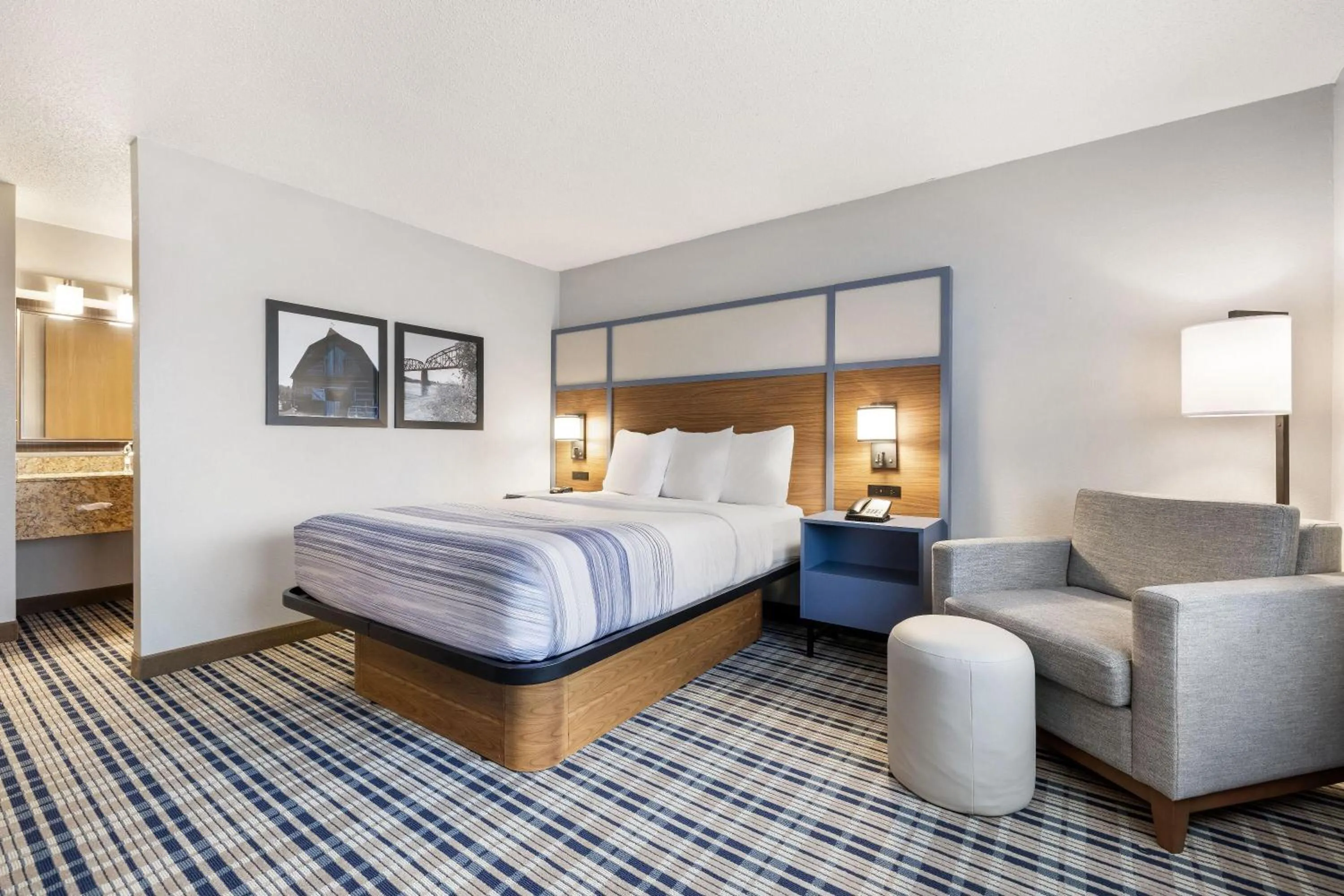 Bed in AmericInn by Wyndham Bismarck