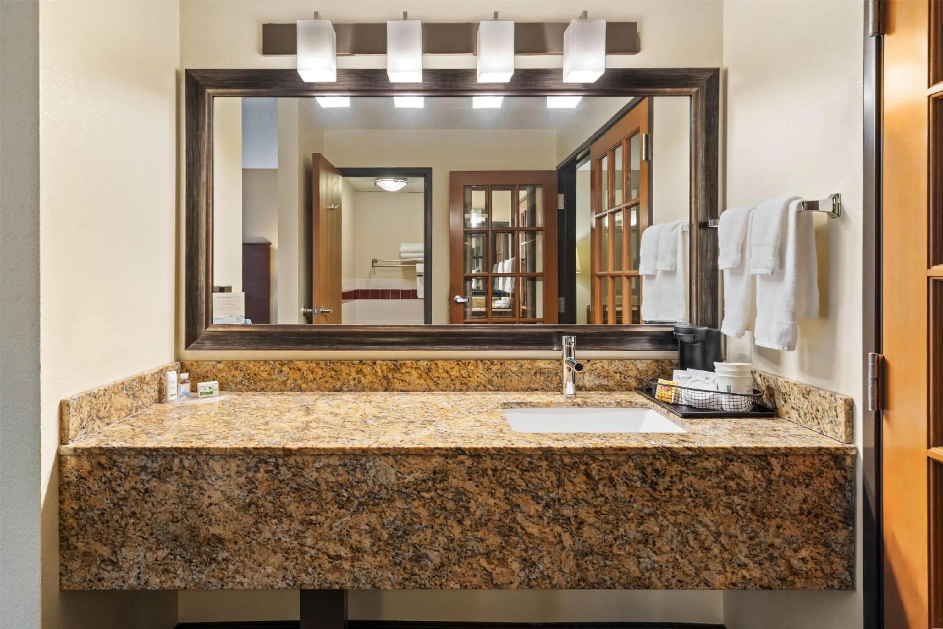 Bathroom in AmericInn by Wyndham Bismarck