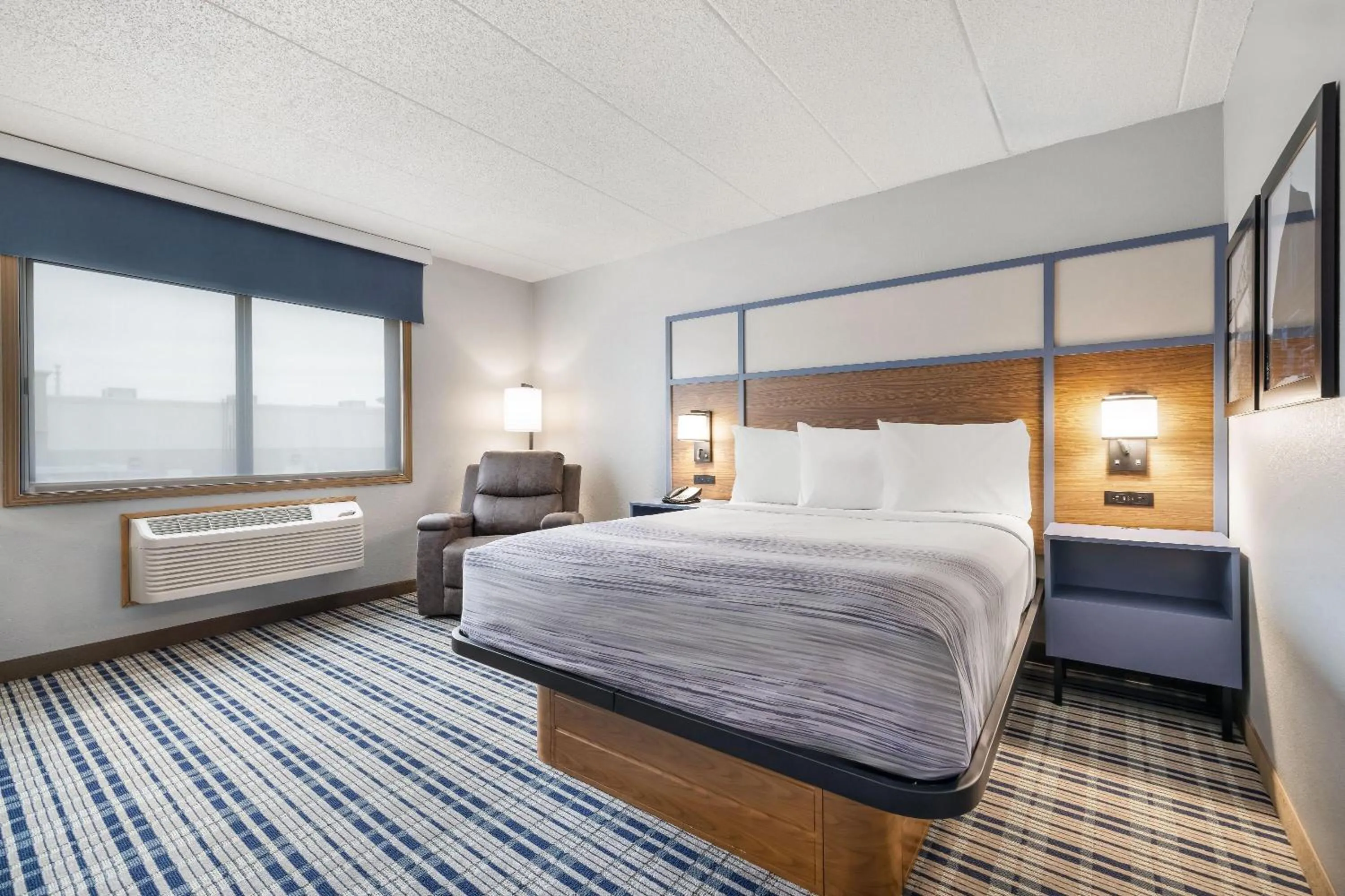 Bed in AmericInn by Wyndham Bismarck