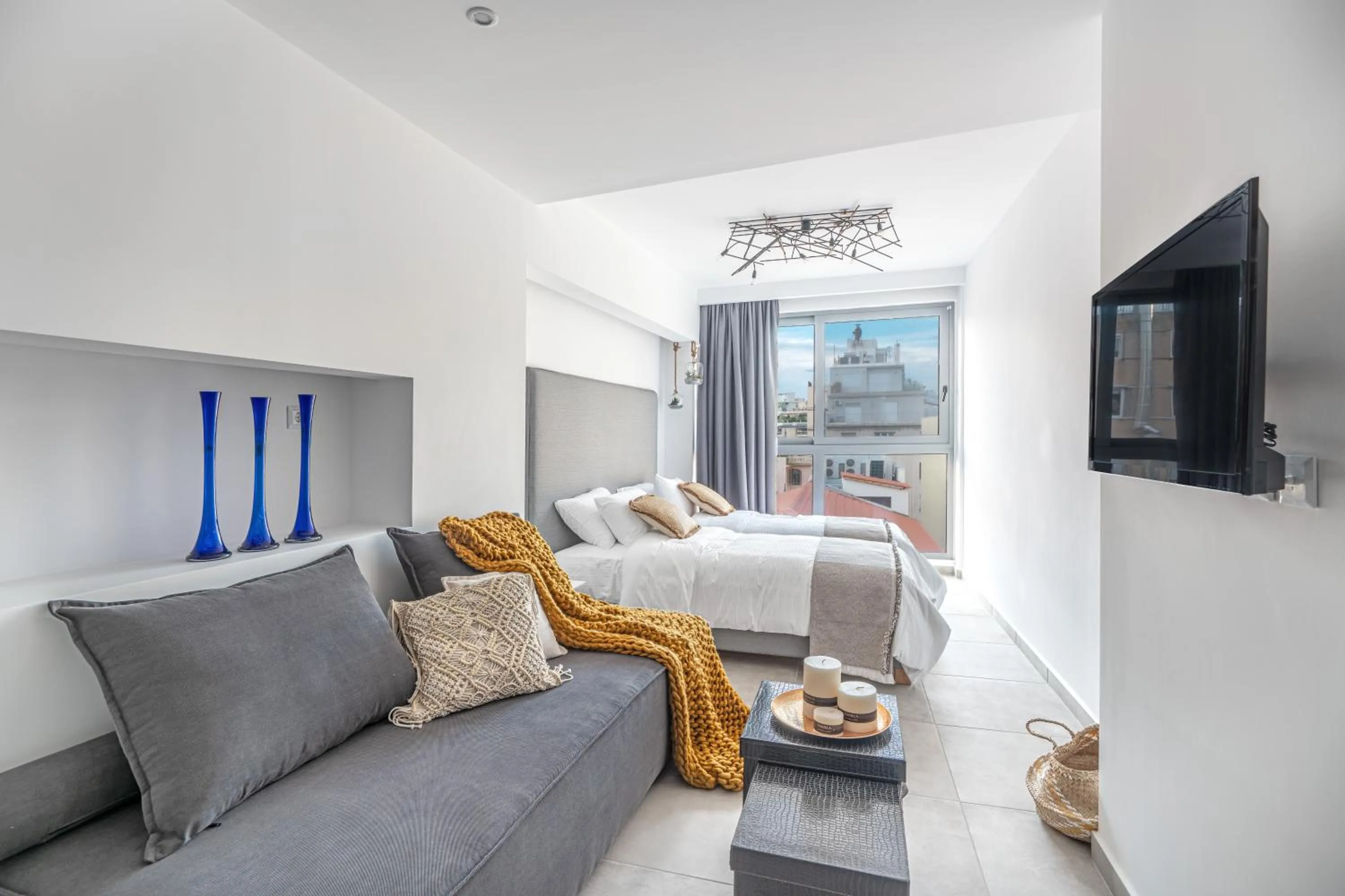 Bed in Mythos Luxury Suites