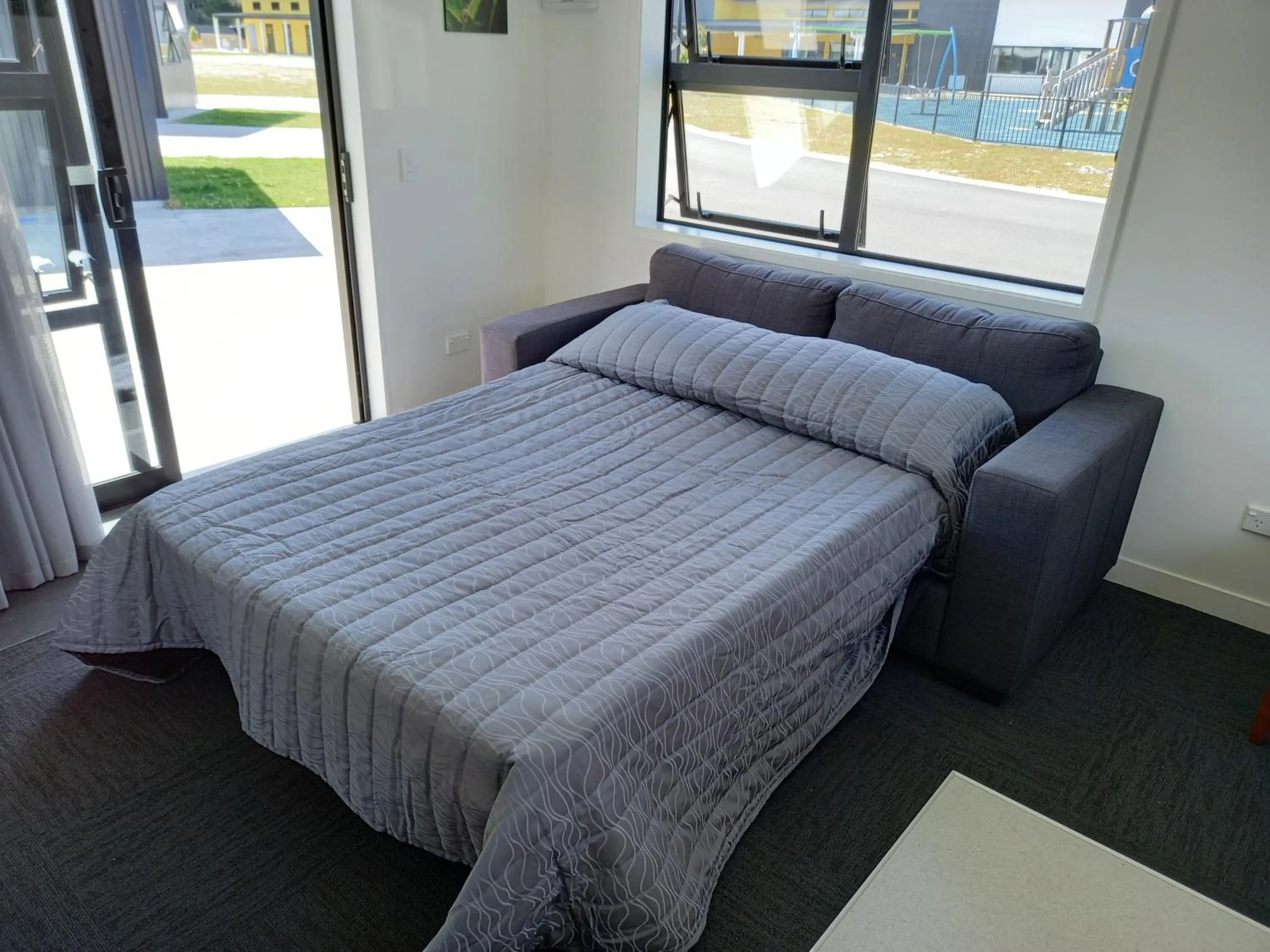 Bed in Hokitika's Kiwi Holiday Park and Motels