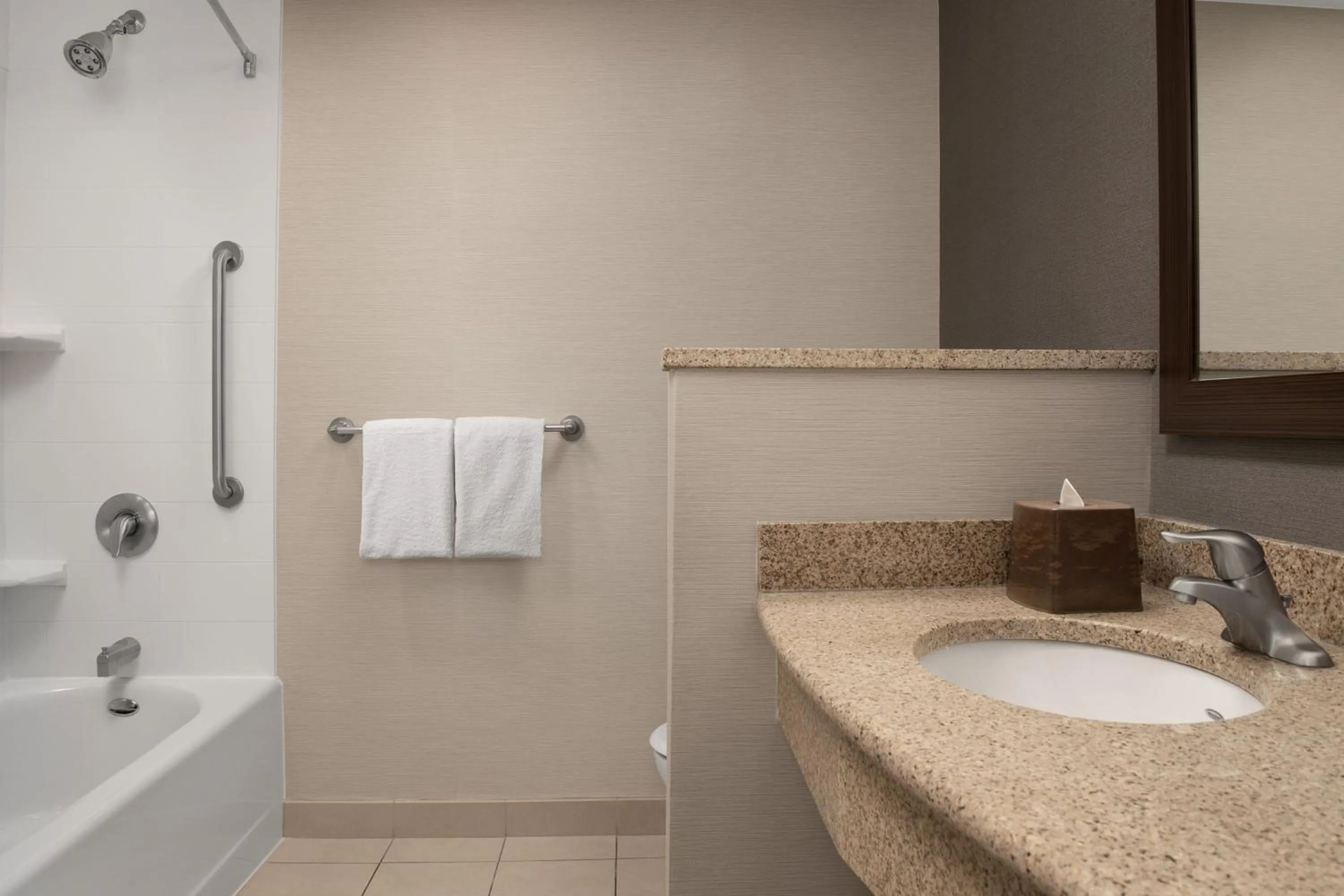 Bathroom in Courtyard by Marriott Syracuse Downtown at Armory Square