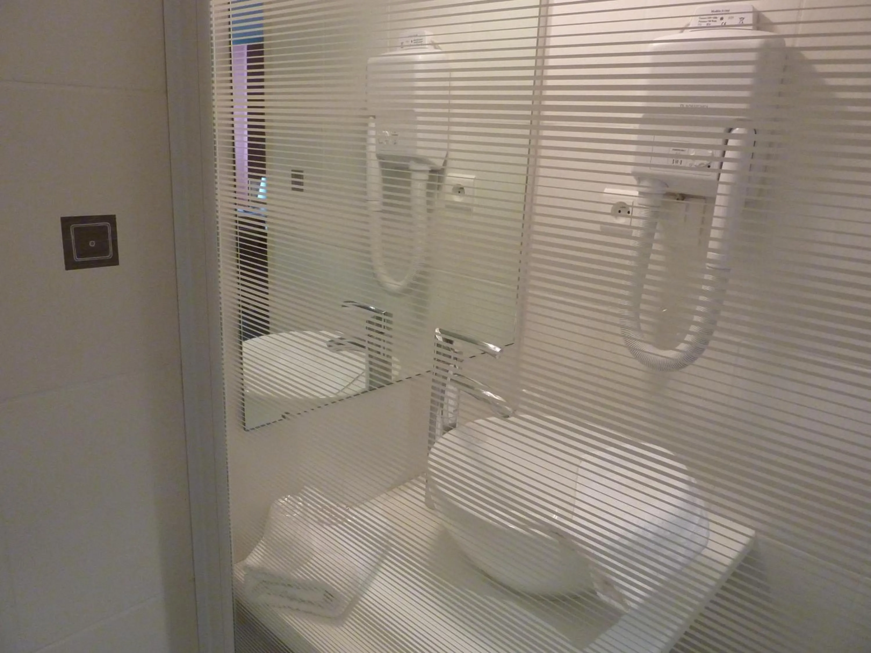 Bathroom in Cit'Hotel de La Vallée