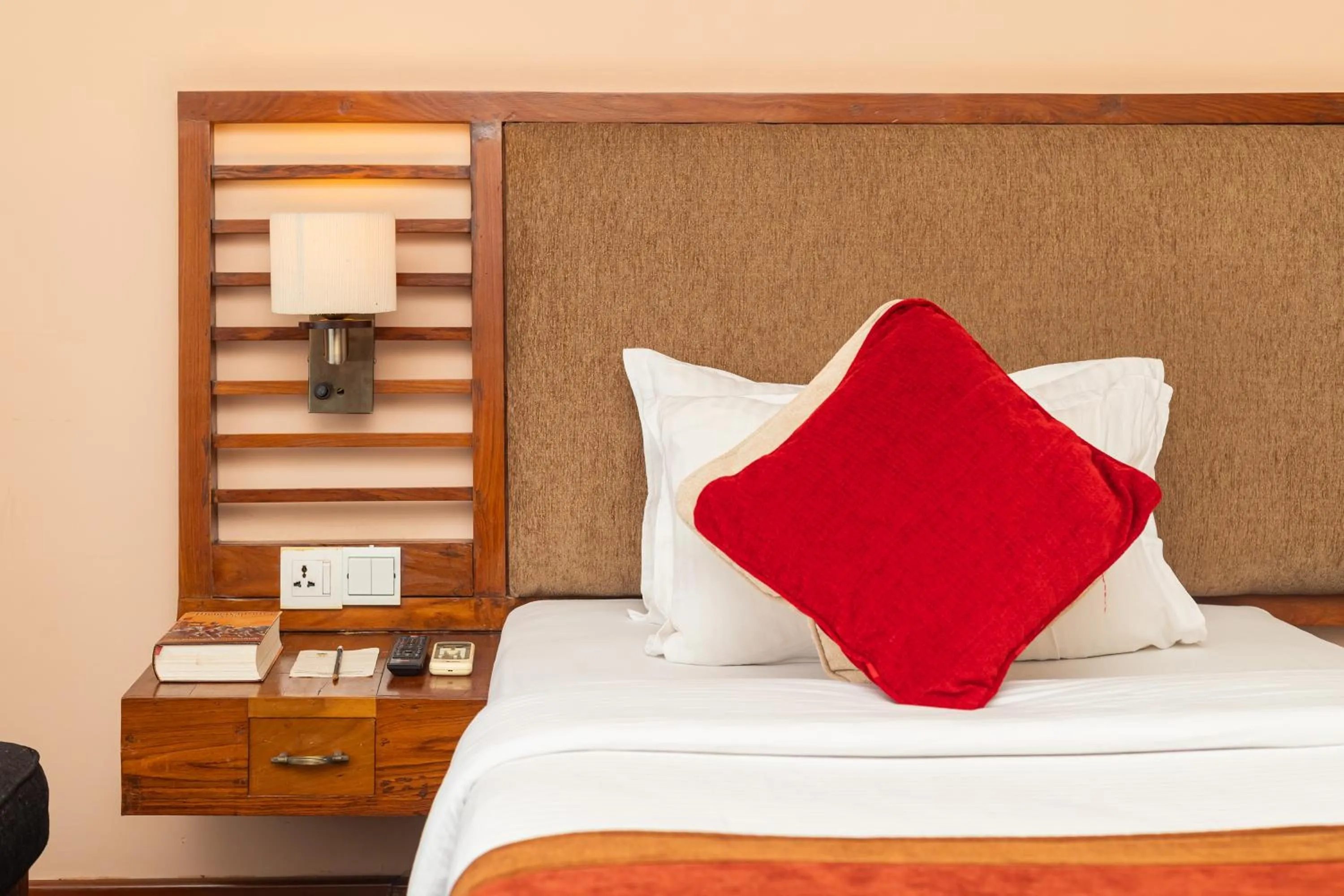 Bed in Atithi Resort & Spa