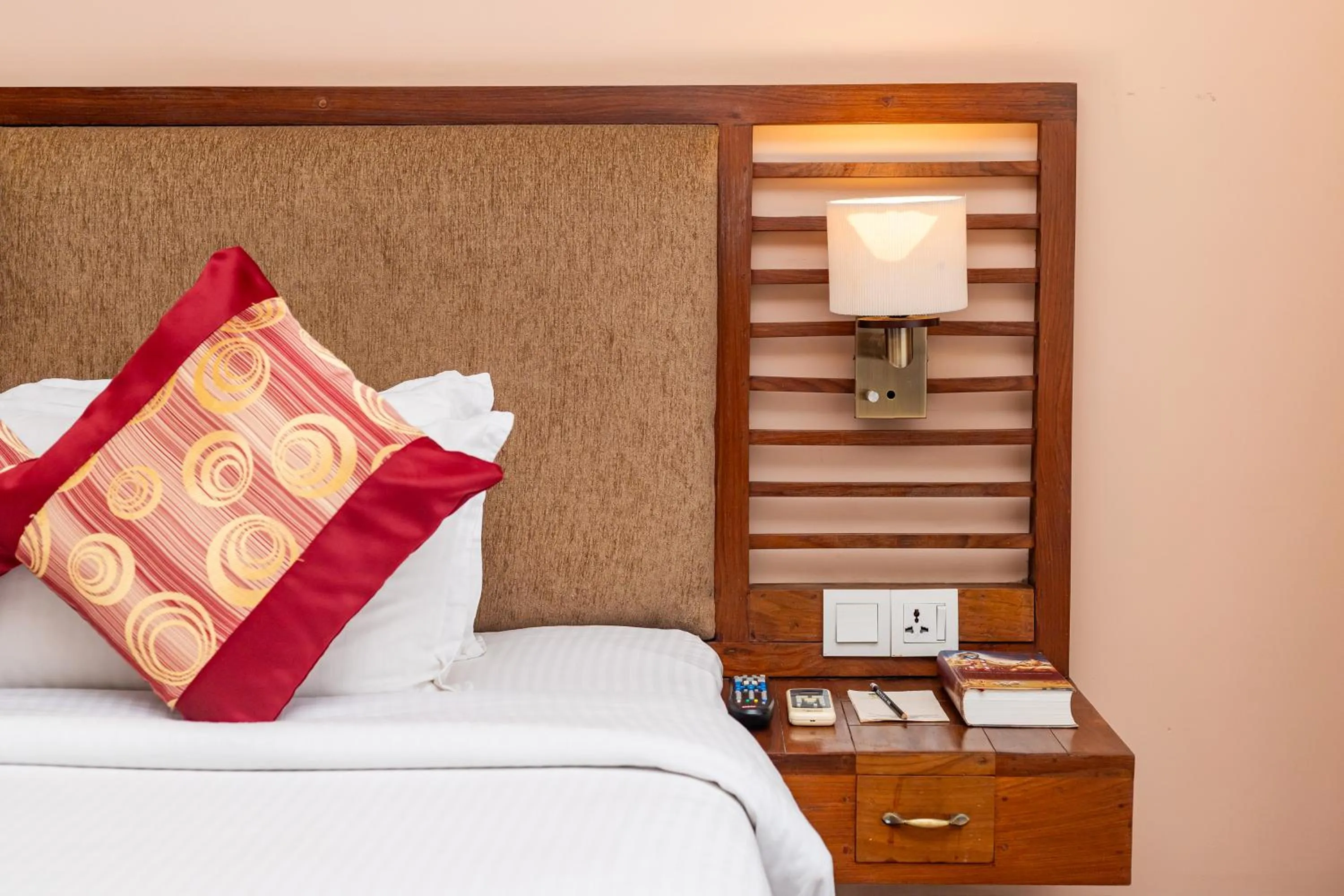 Bed in Atithi Resort & Spa