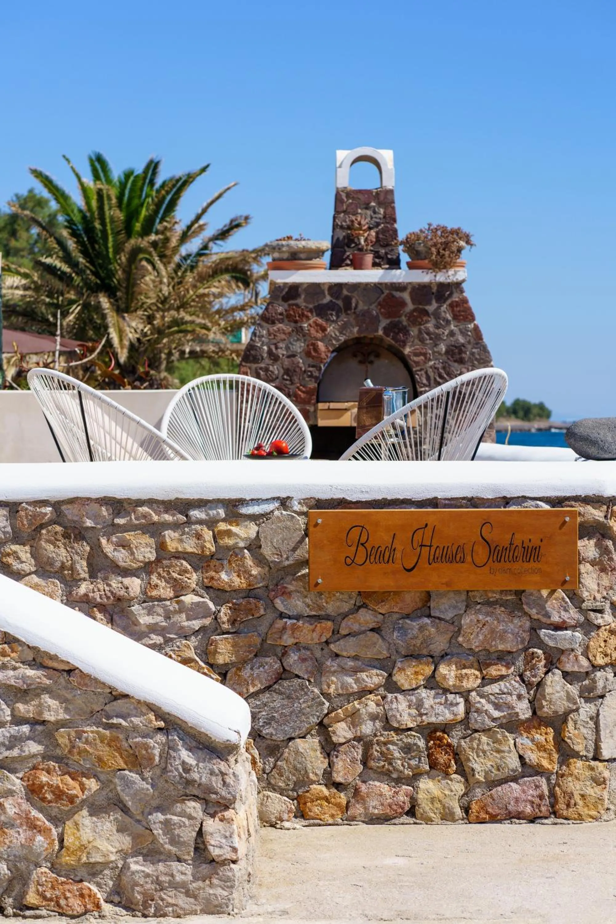 Property logo or sign in Beach Houses Santorini