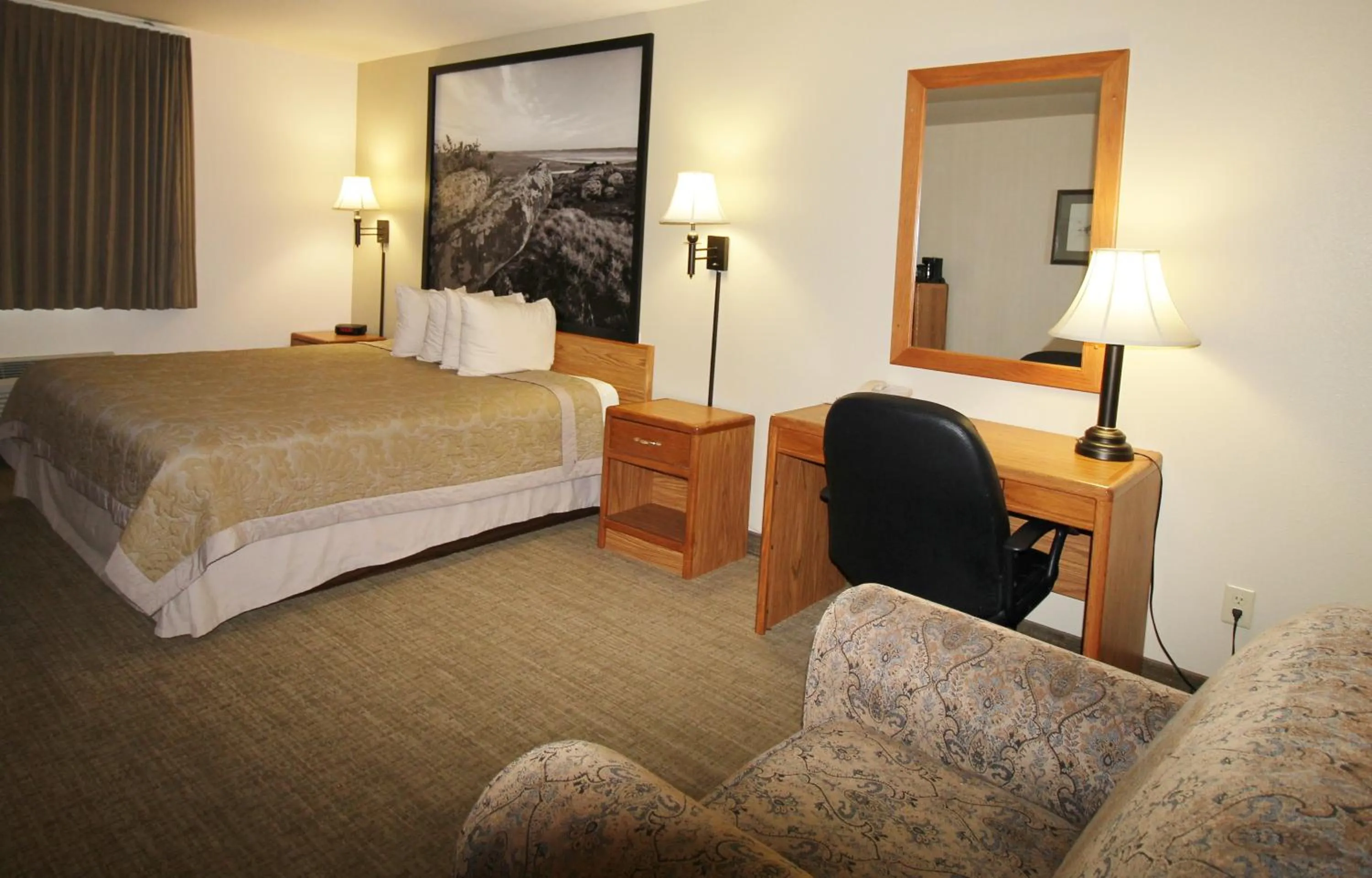 Bed in Homestead Inn and Suites