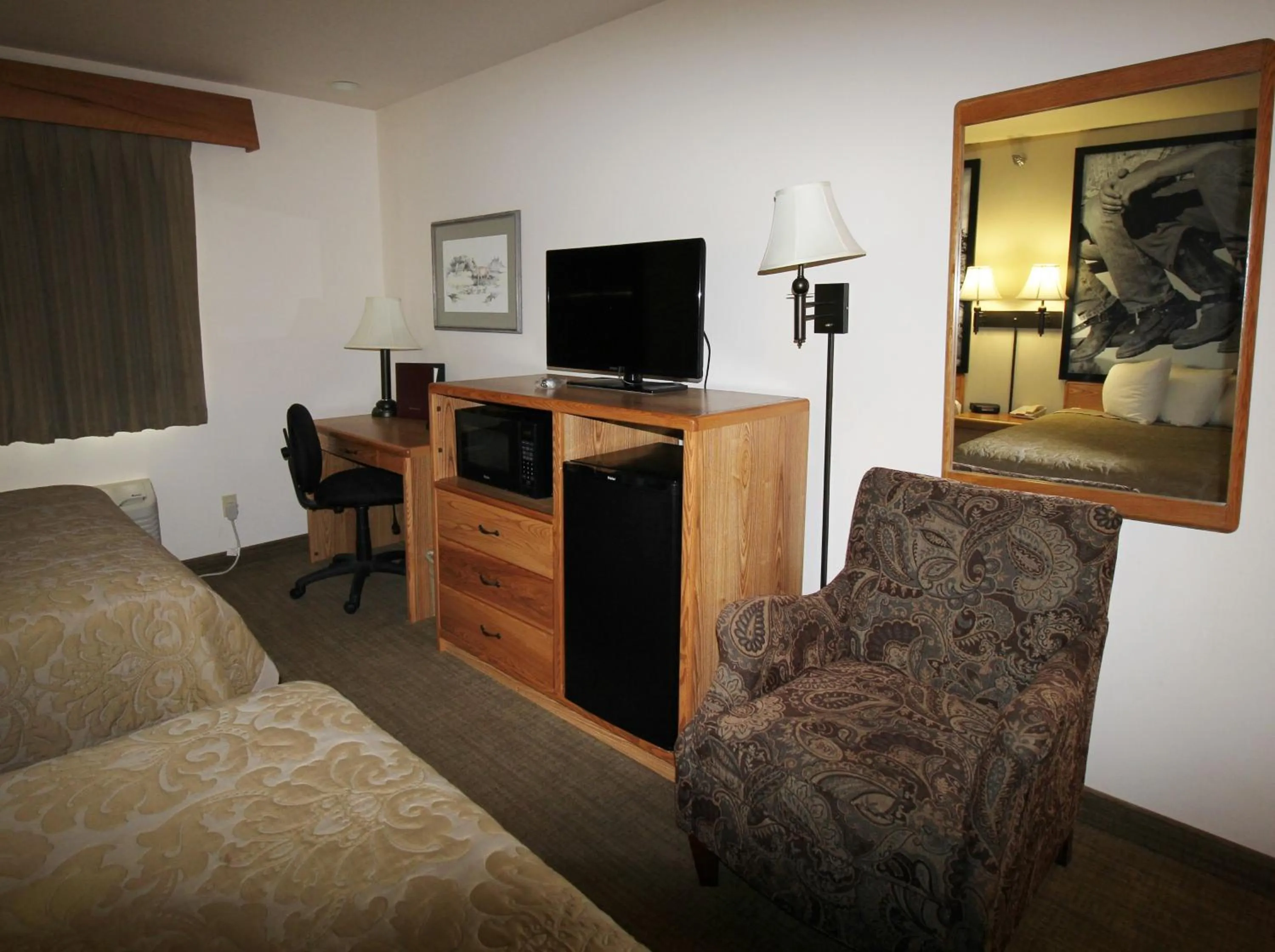 Bed in Homestead Inn and Suites