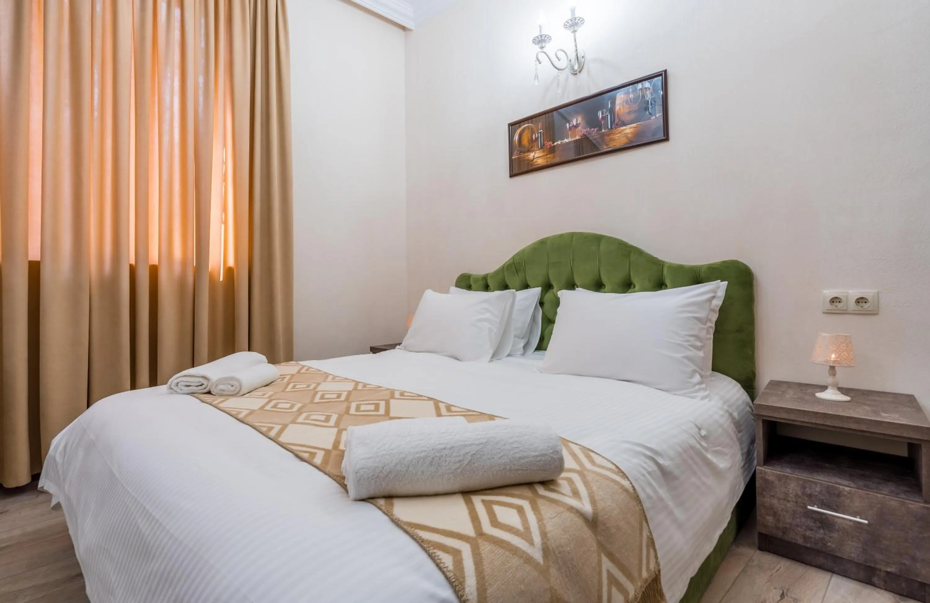 Bed in Golden Light Hotel