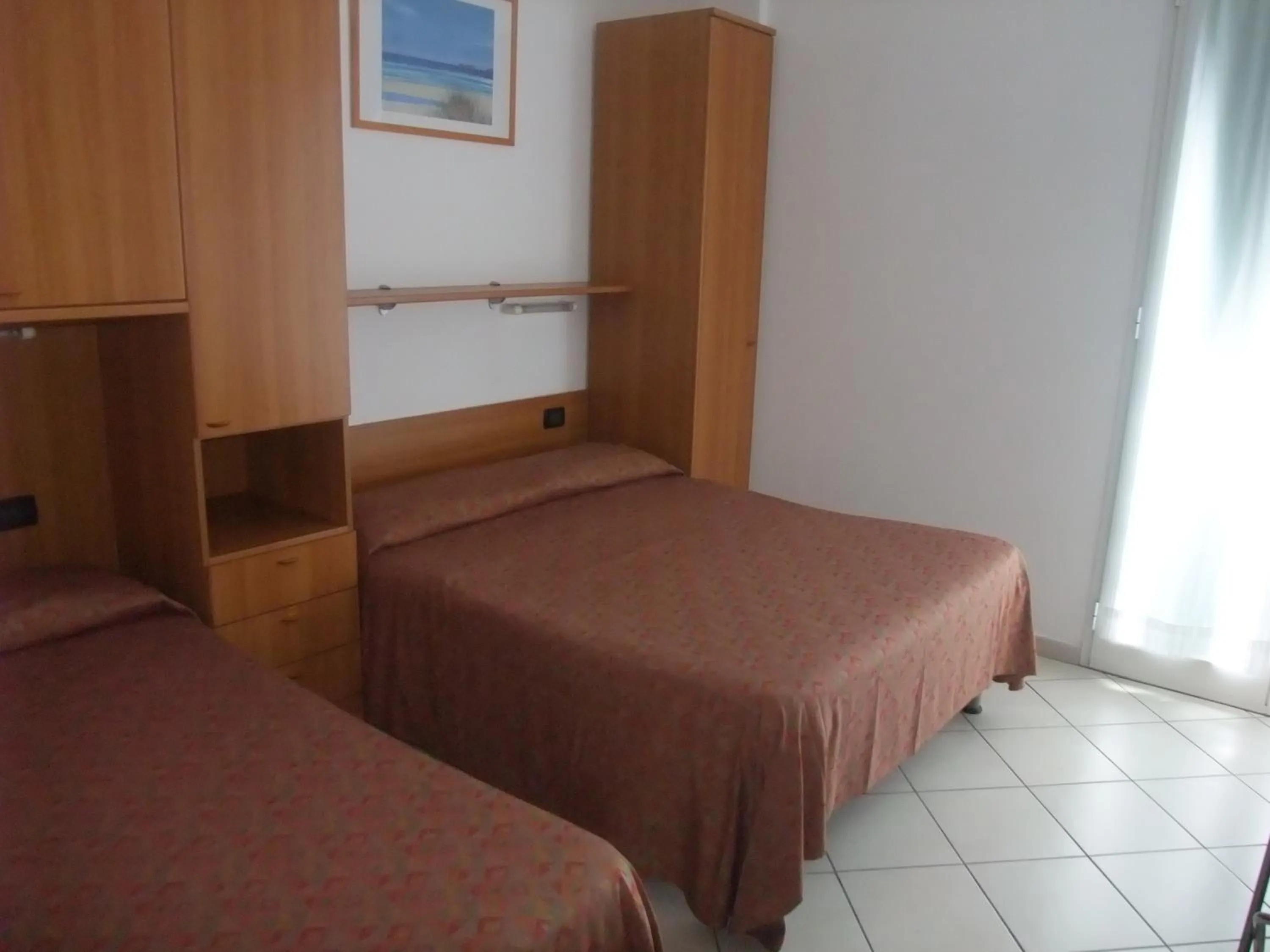 Bed in Hotel Adriana