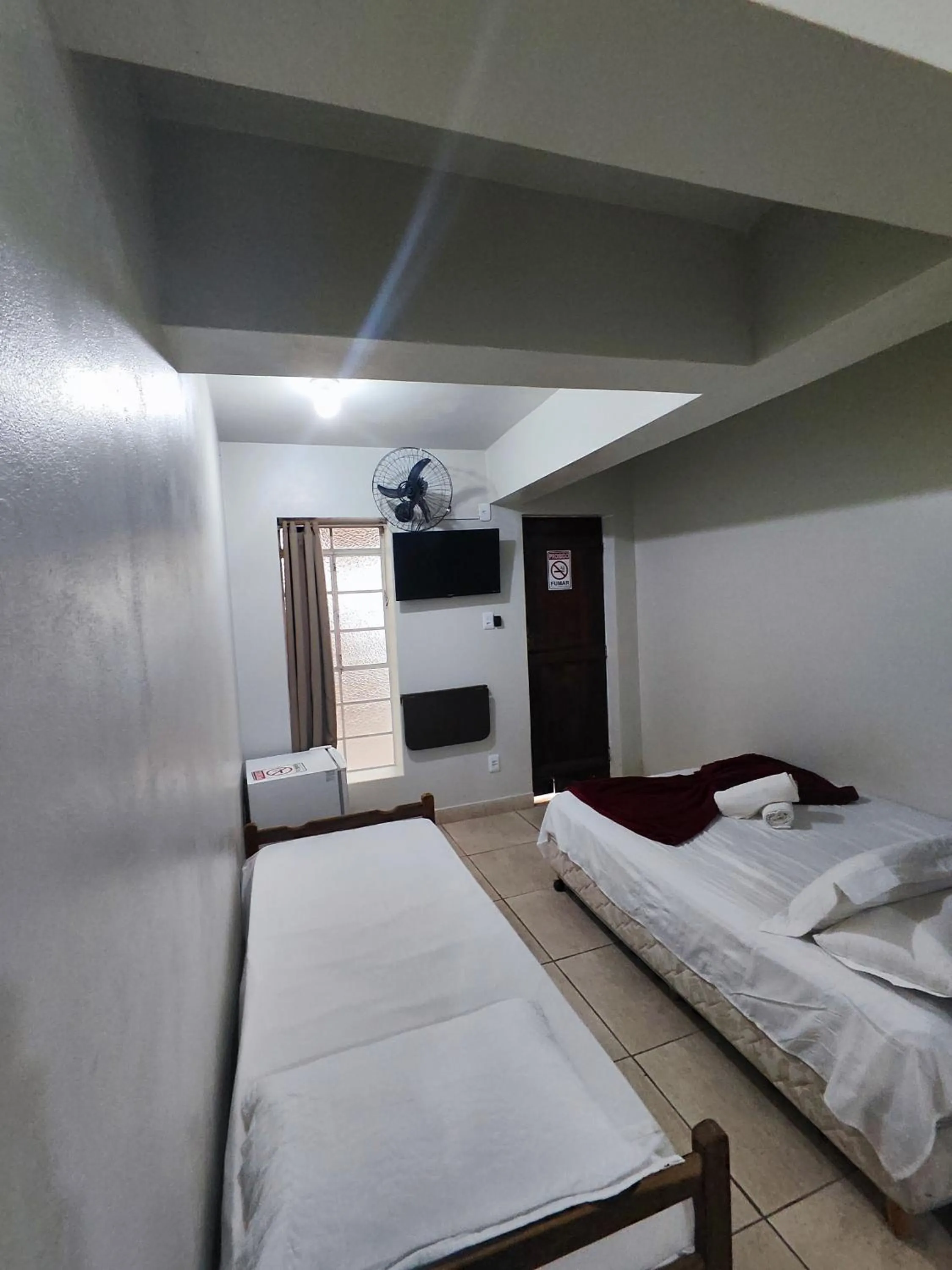 Bed in Pousada Acayaca