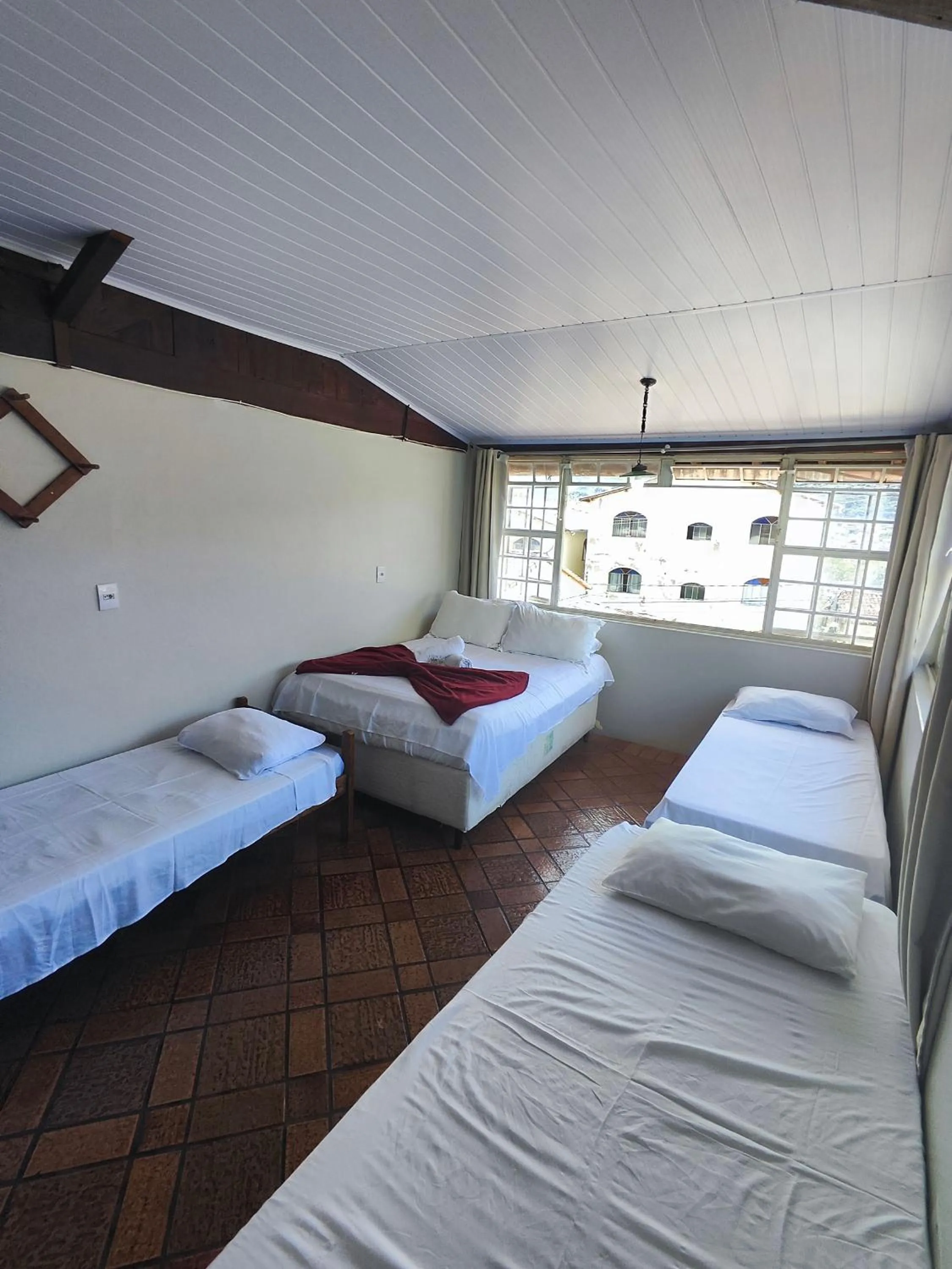 Bed in Pousada Acayaca